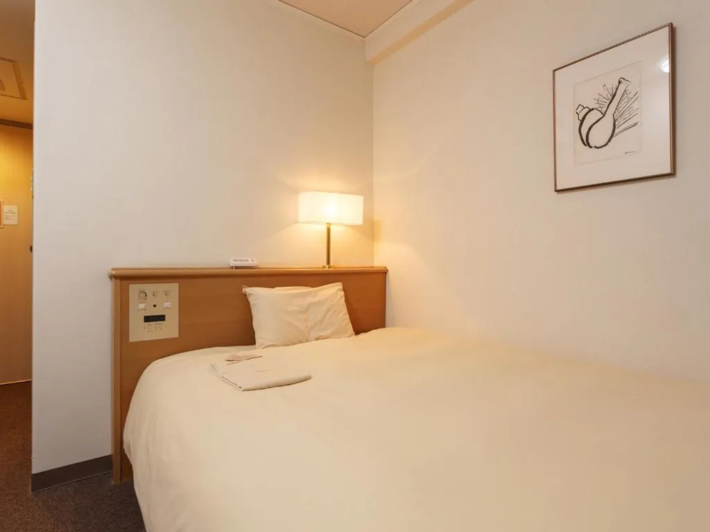 Bed in AkishimaStationHotel TOKYO