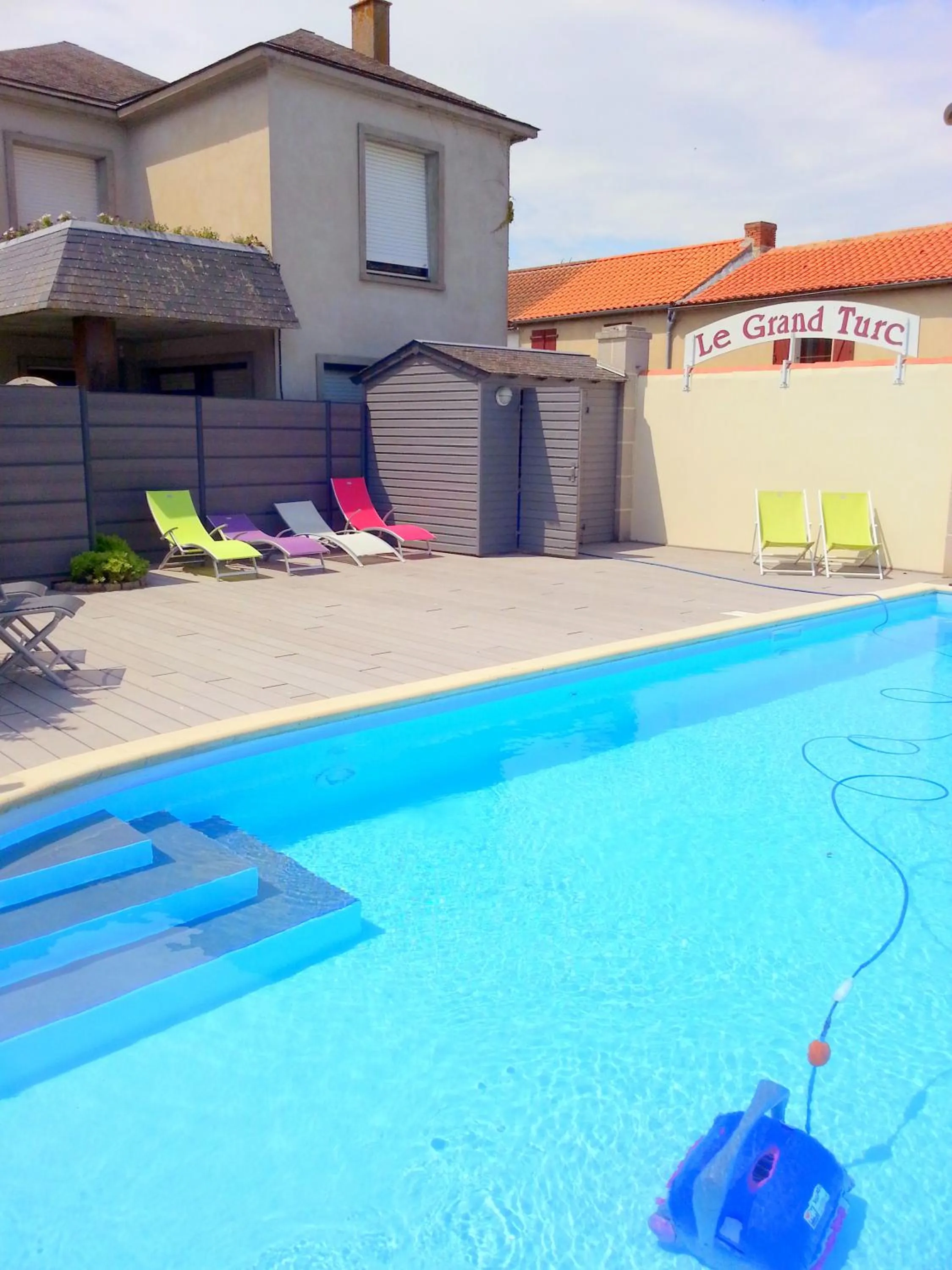 Swimming pool in Logis Hotel Restaurant Le Grand Turc