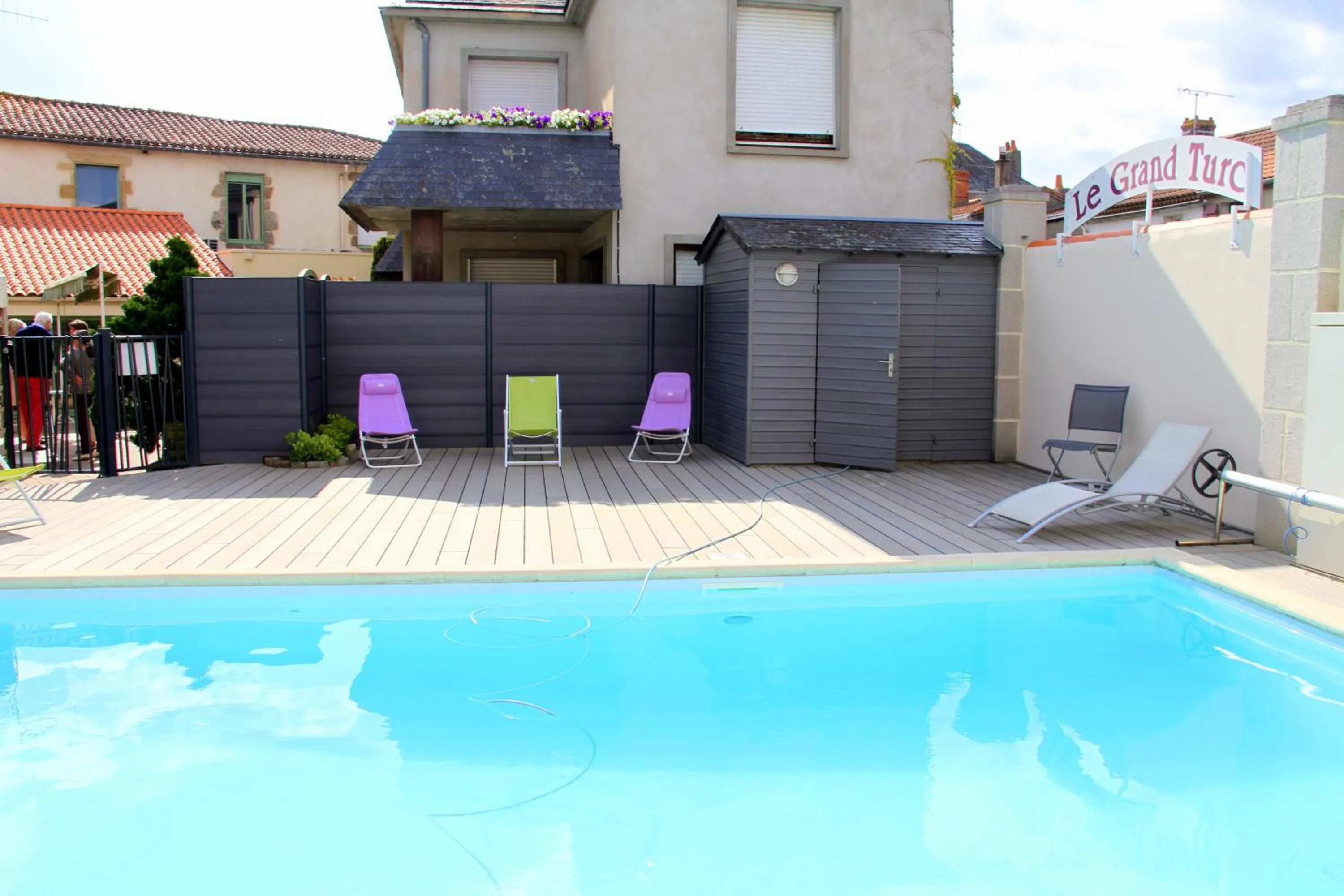 Swimming pool in Logis Hotel Restaurant Le Grand Turc