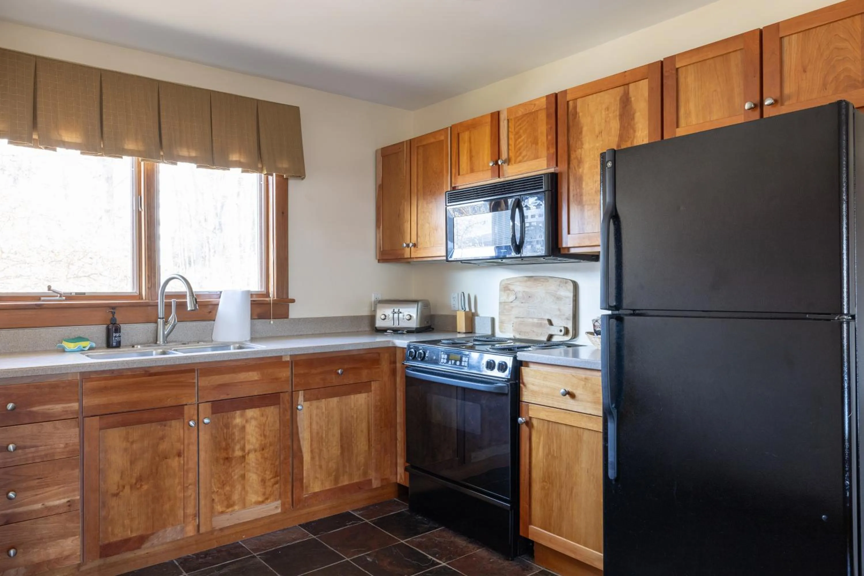 Kitchen or kitchenette in Winwood Condominiums by Windham Mountain Club