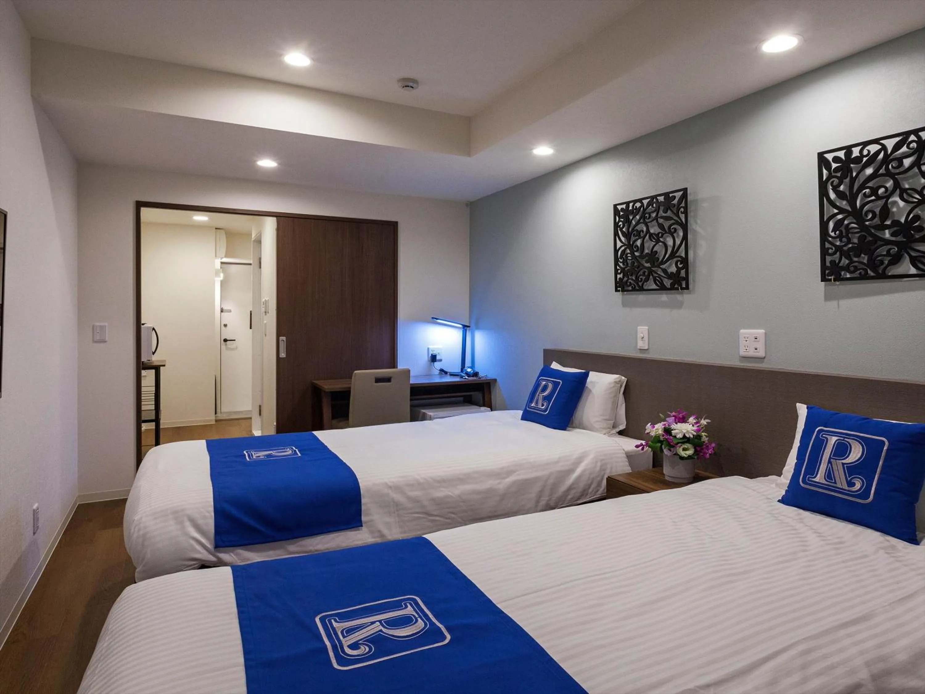 Bed in Living Inn Asahibashiekimae Premier