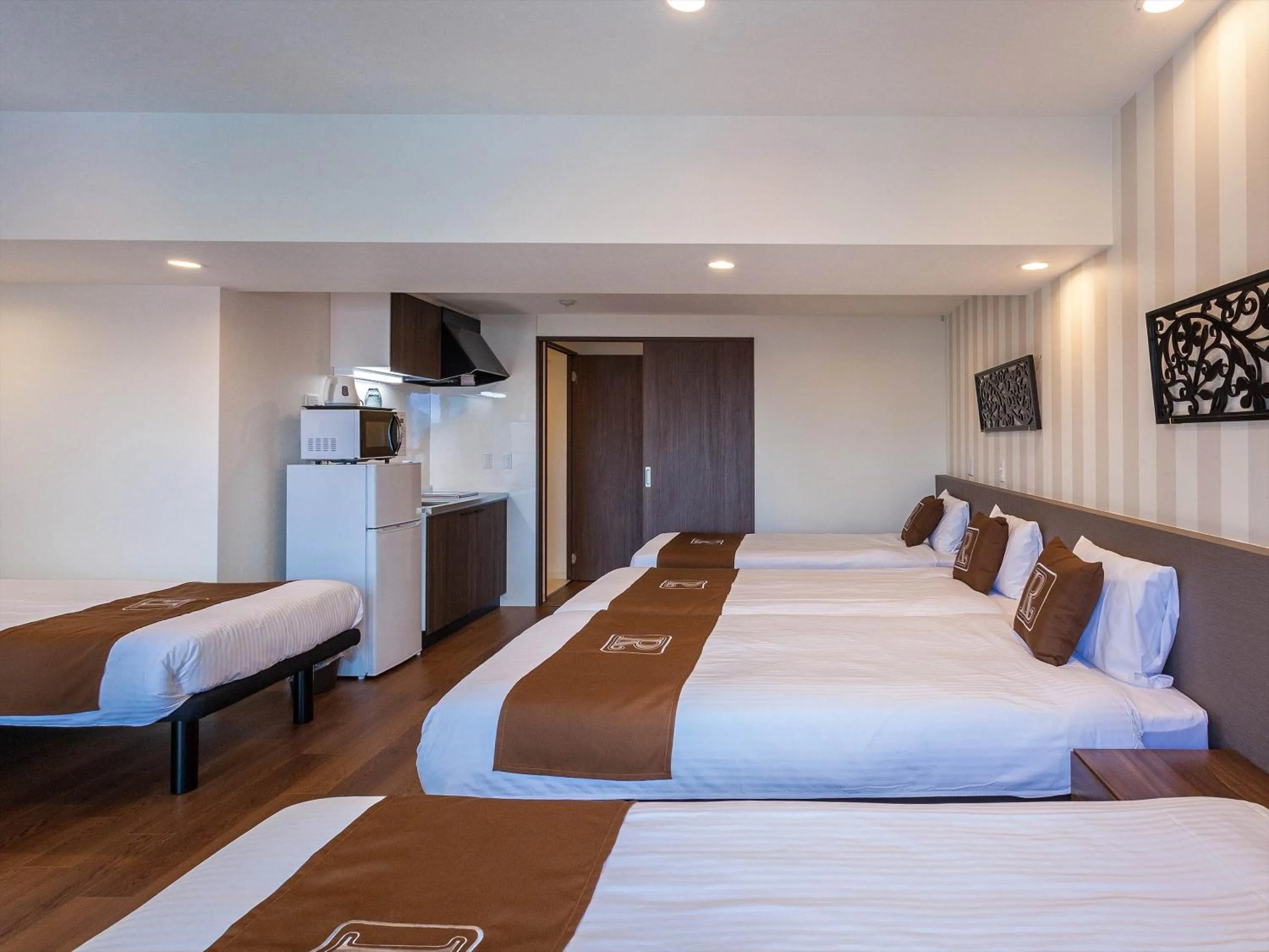 Bed in Living Inn Asahibashiekimae Premier