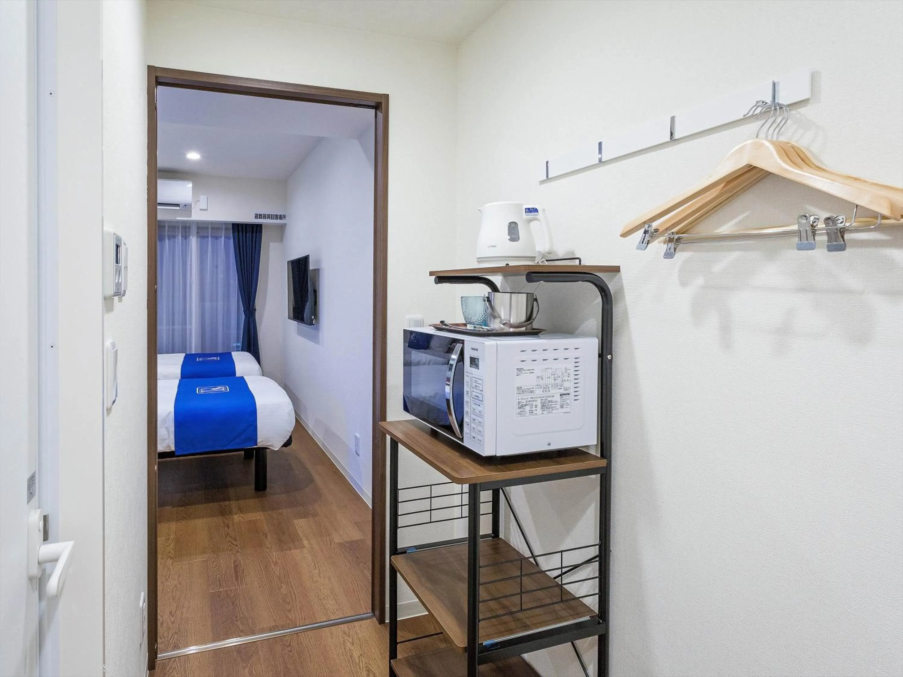 Bed in Living Inn Asahibashiekimae Premier