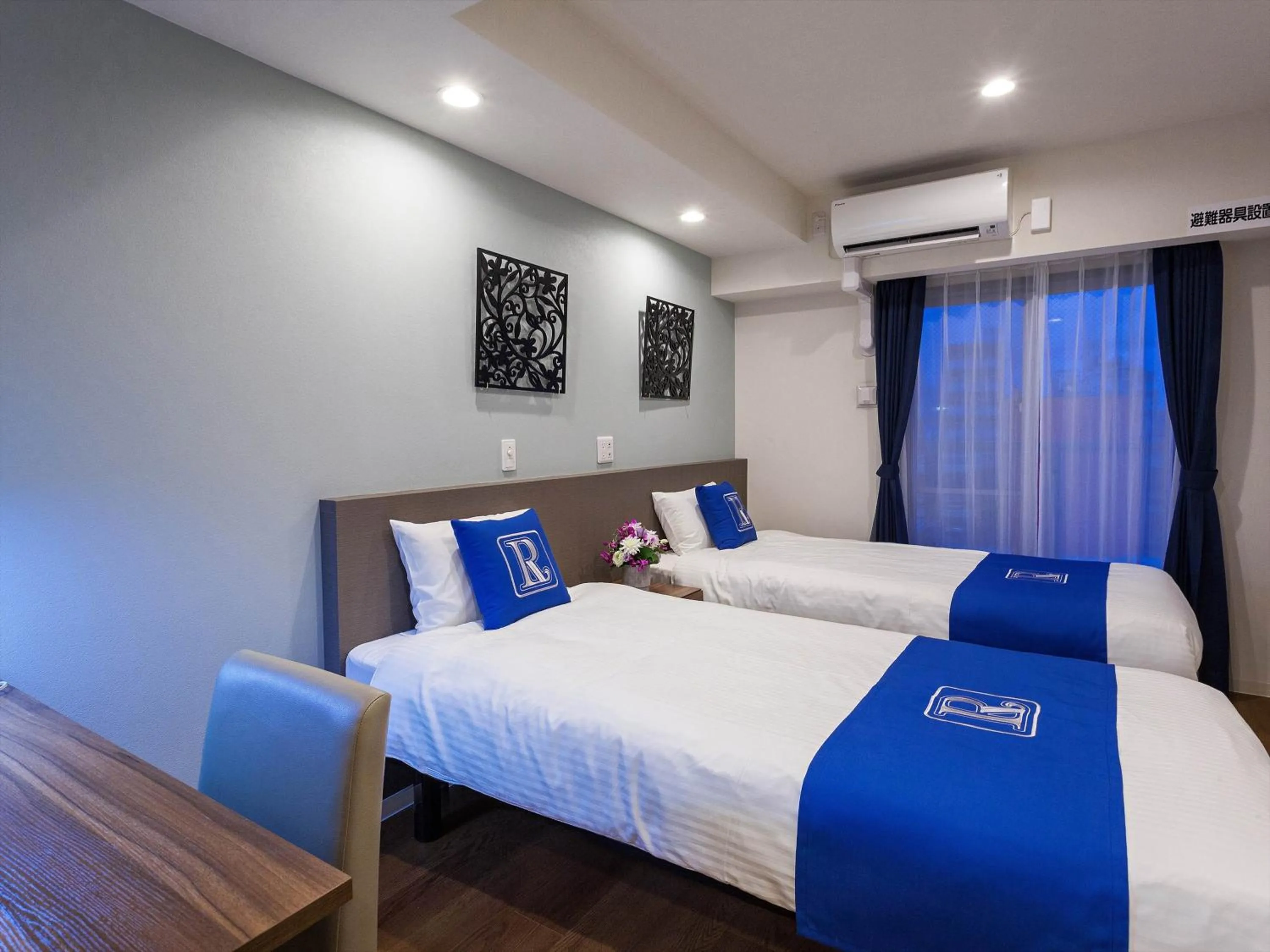 Bed in Living Inn Asahibashiekimae Premier