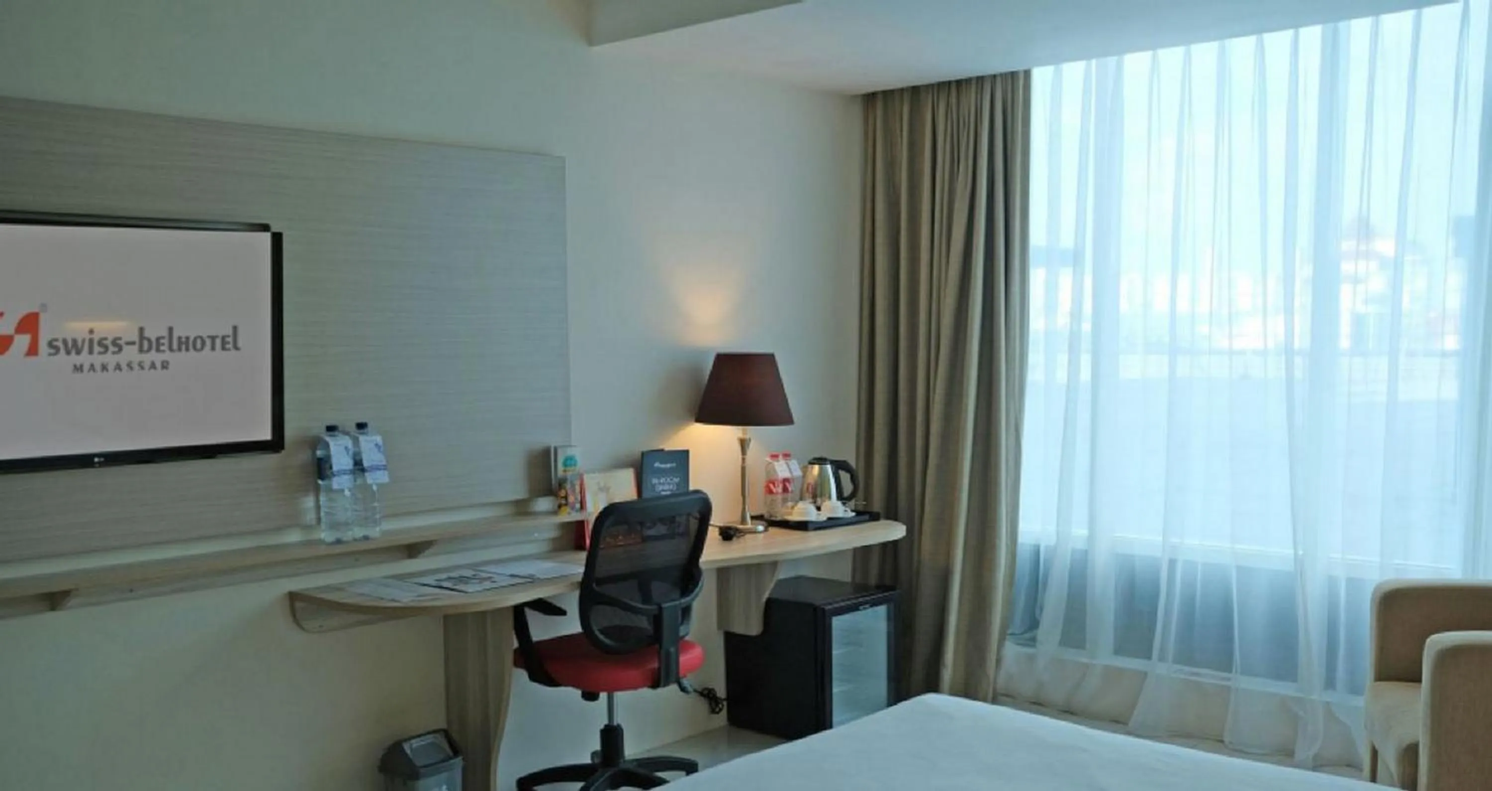 Bed in Swiss-Belhotel Makassar