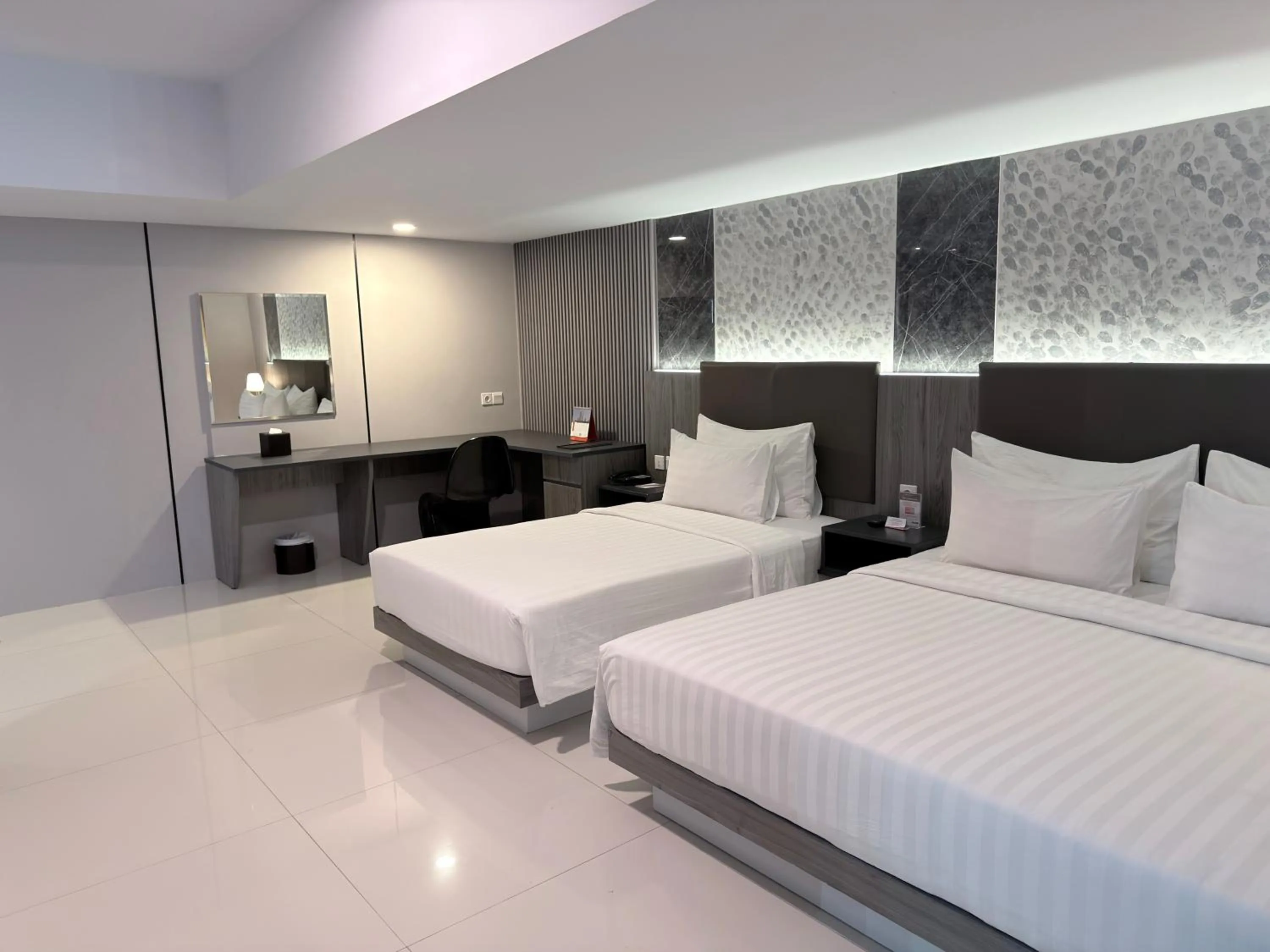 Bed in Swiss-Belhotel Makassar
