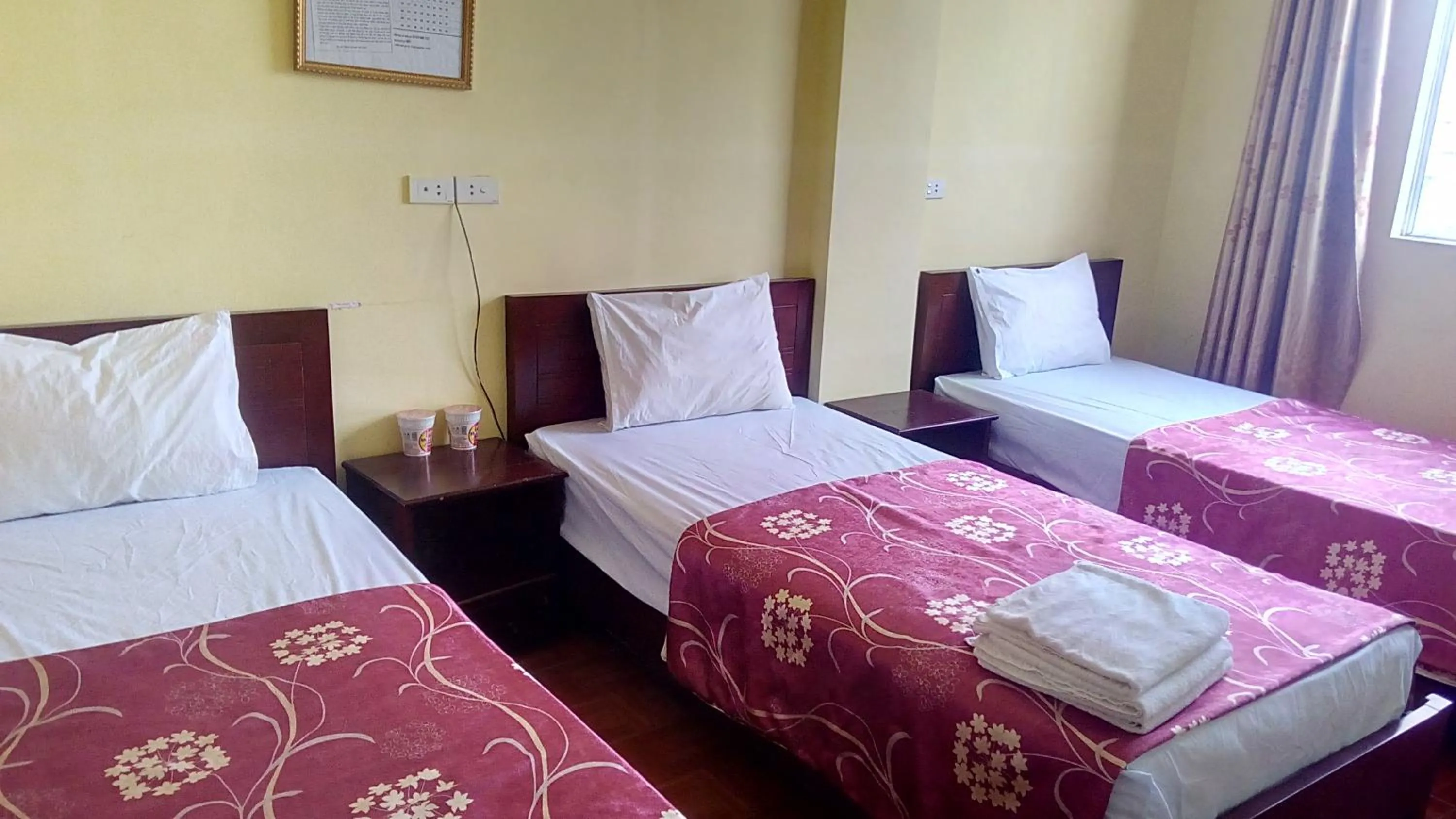 Bed in Hai Duong Hotel