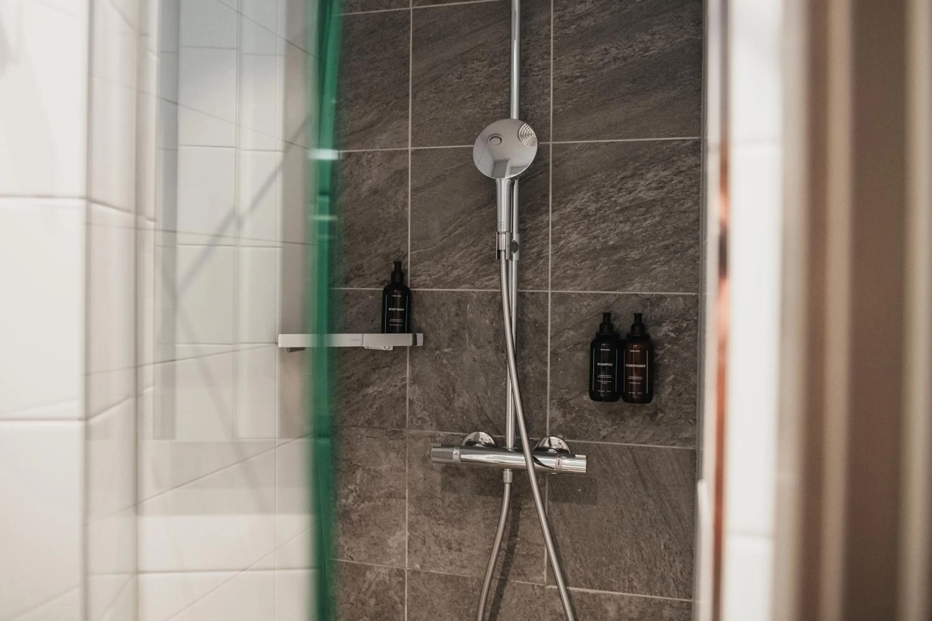 Shower in Home Hotel Bergmästaren