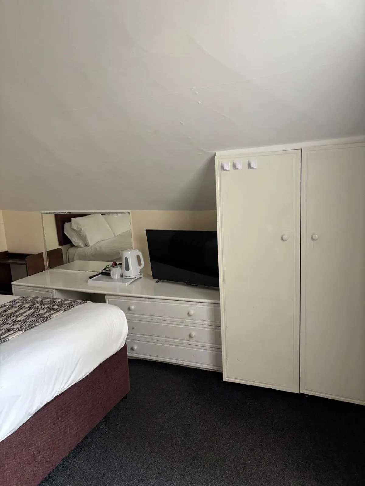 Bed in The Tudor House Hotel