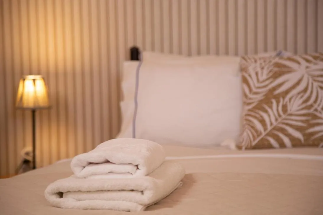 Bed in Poseidon Apartments and Villas by the Sea