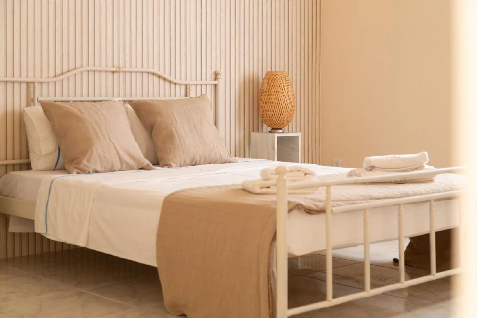 Bed in Poseidon Apartments and Villas by the Sea