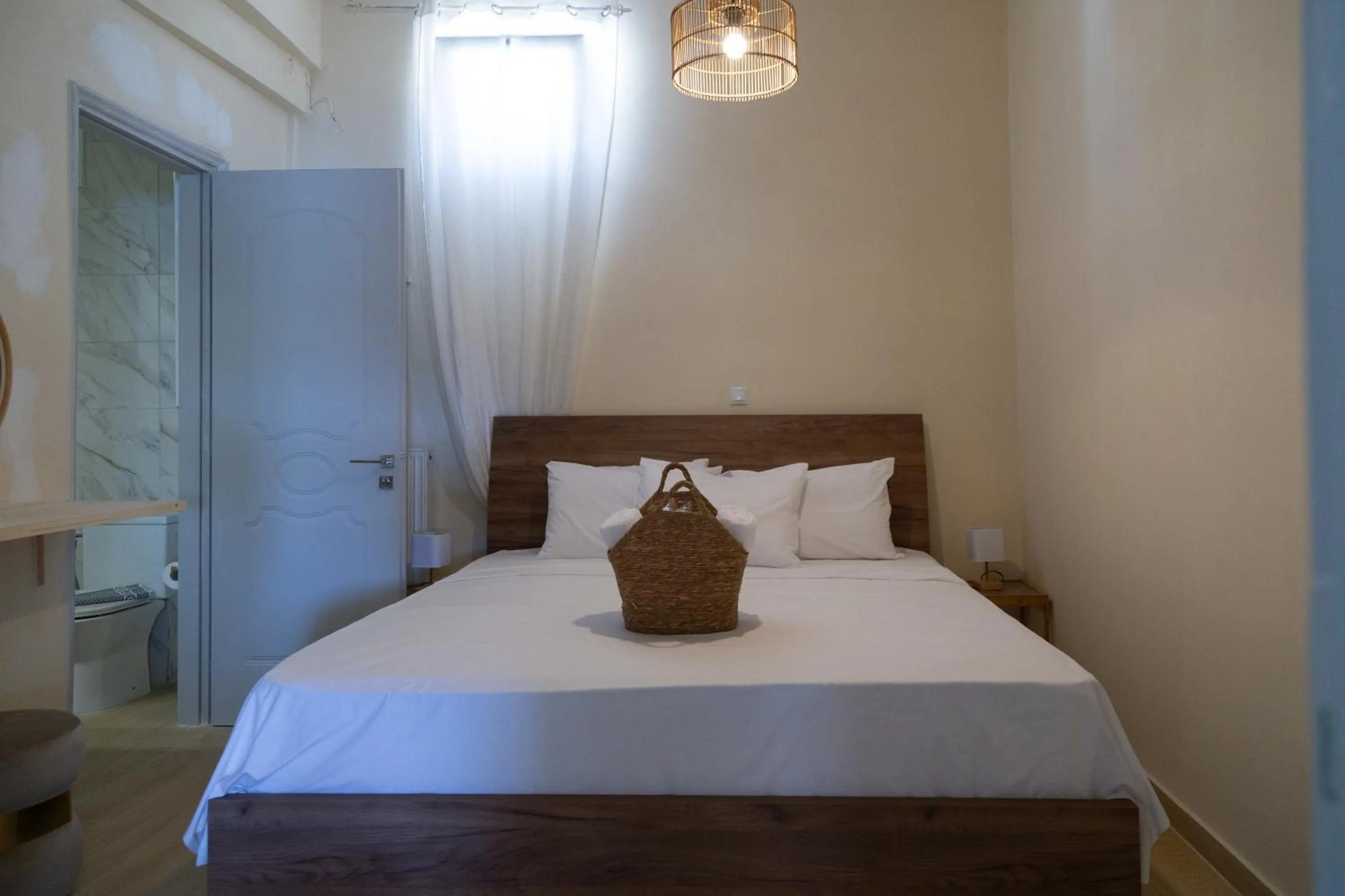 Bed in Poseidon Apartments and Villas by the Sea