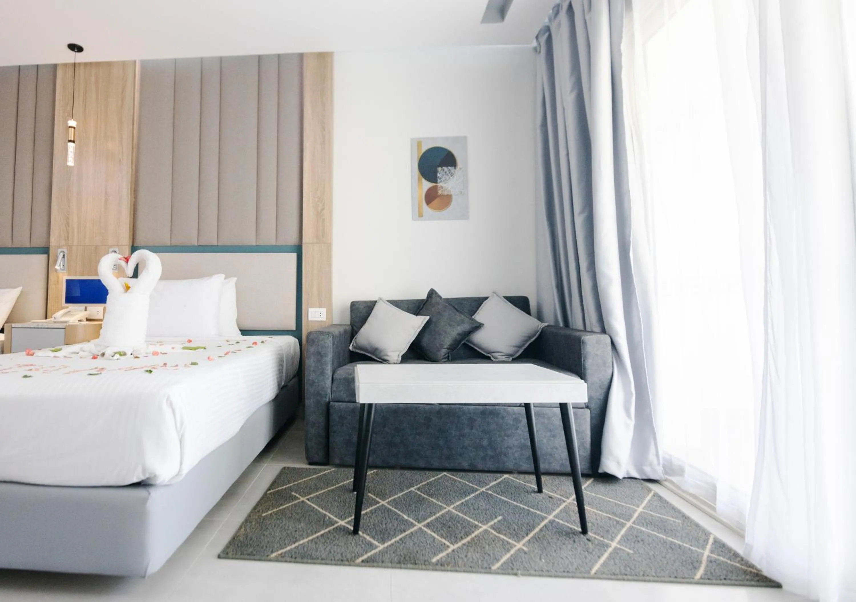 Seating area, Bed in Titanic Beach - Families and Couples only