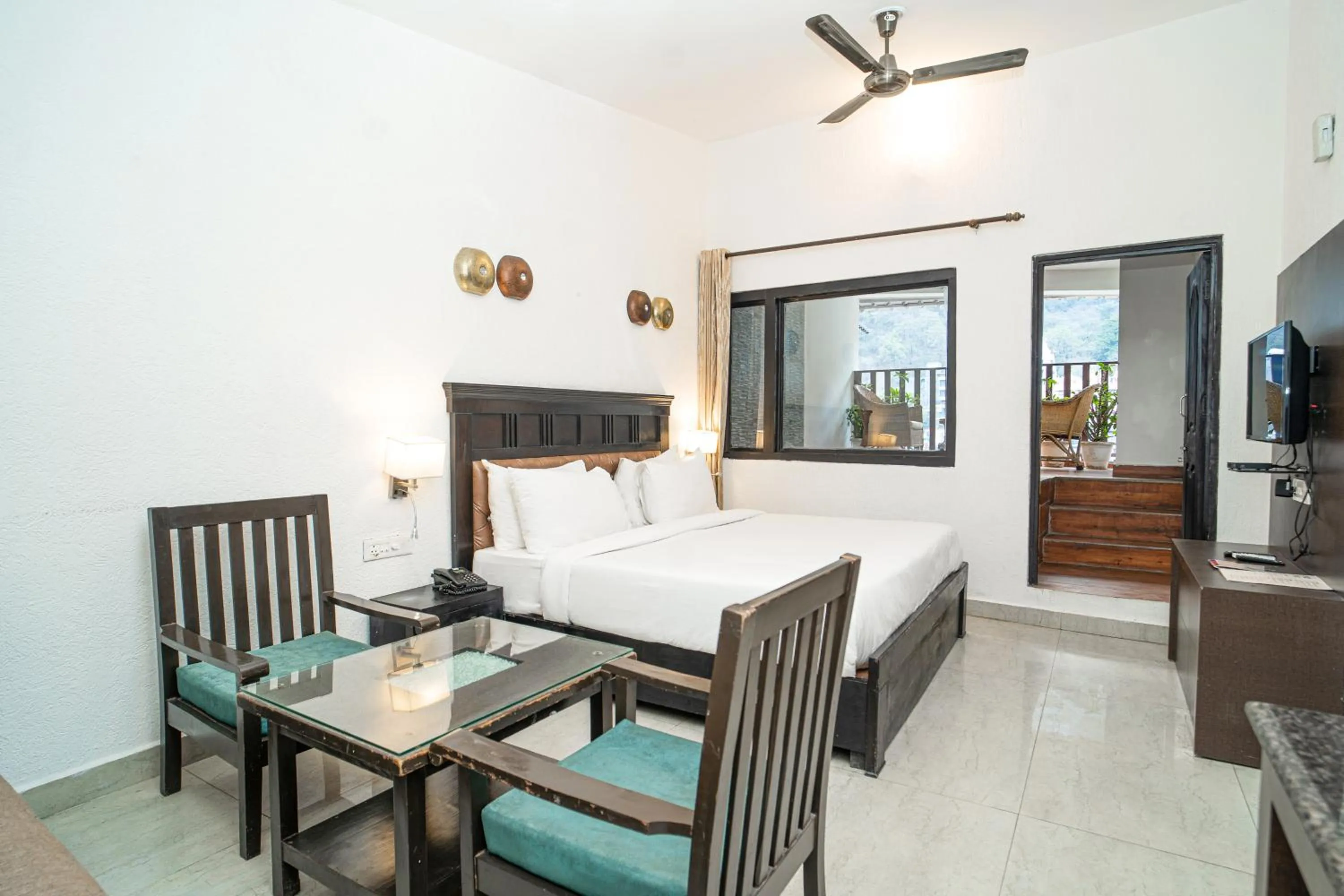 Bed in Hotel Ishan - A Ganges Riverside Retreat by Salvus