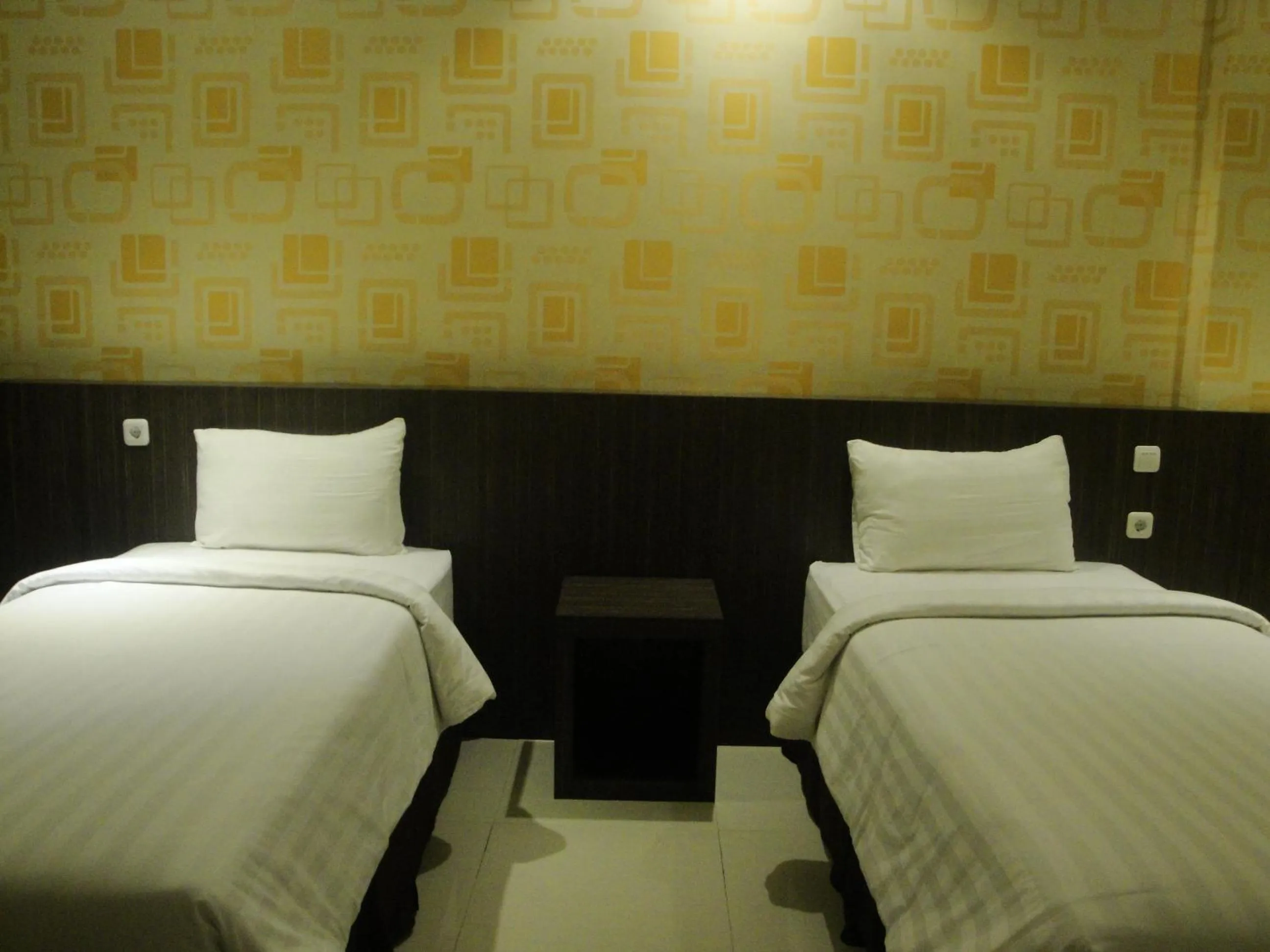 Bed in Sylvia Hotel Budget