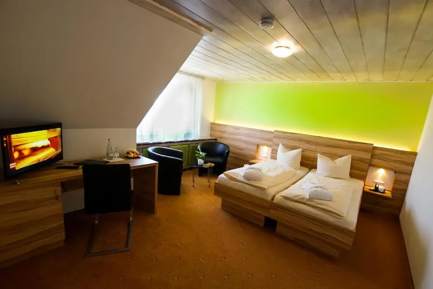 Photo of the whole room, Bed in Hotel Traube Lossburg