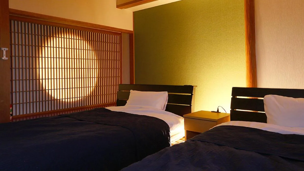 Photo of the whole room, Bed in Okukinosaki Seaside Hotel