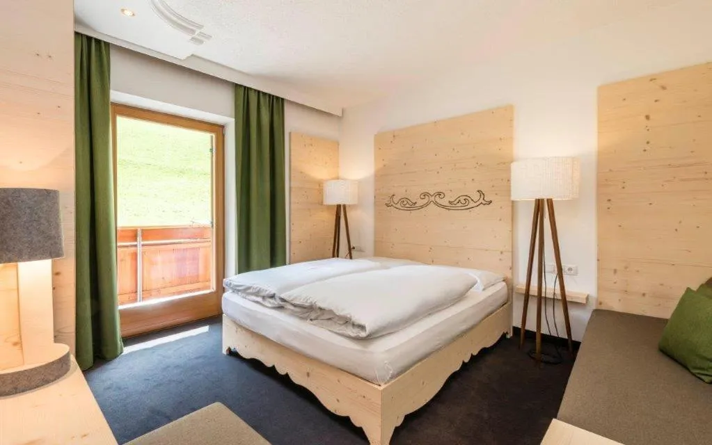 Photo of the whole room, Bed in Hotel Jaufentalerhof