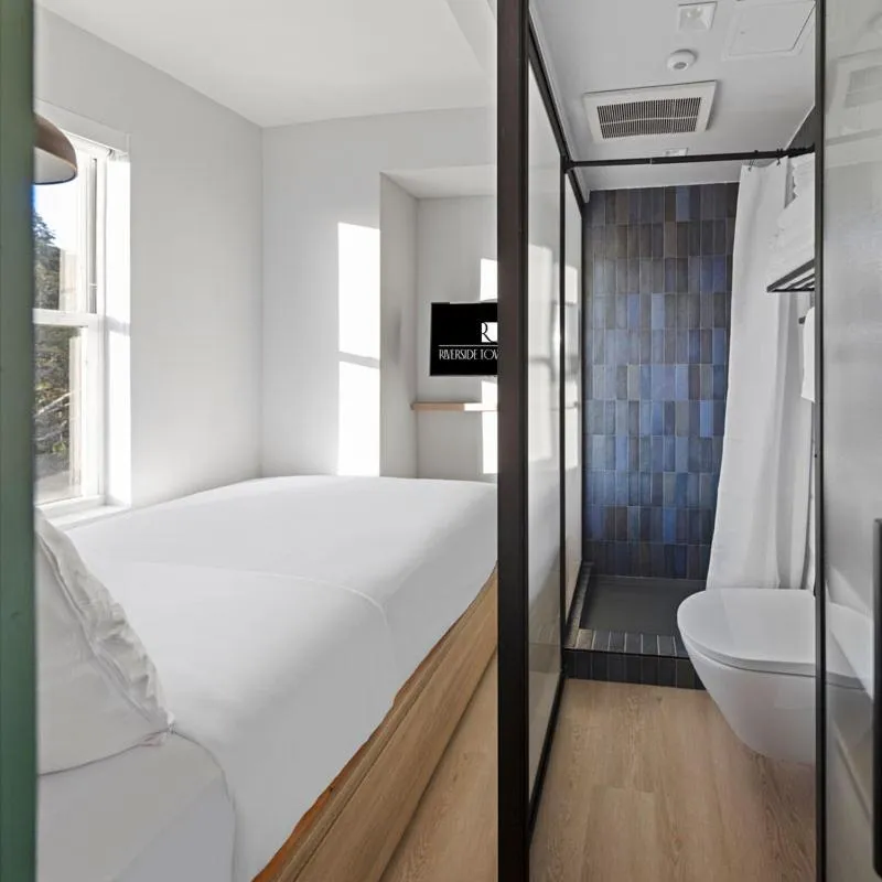 Bed in Riverside Tower Hotel