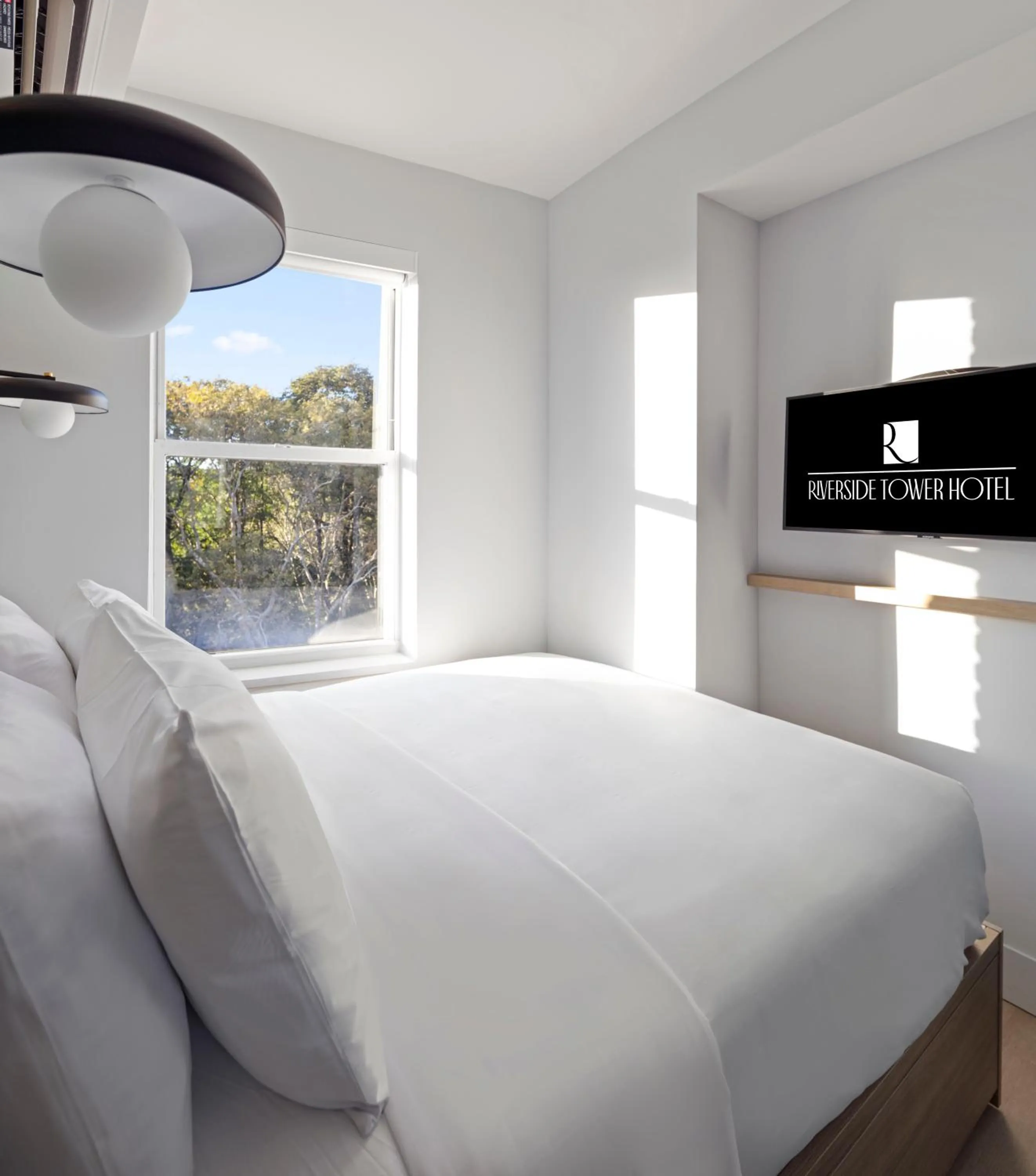 Bed in Riverside Tower Hotel