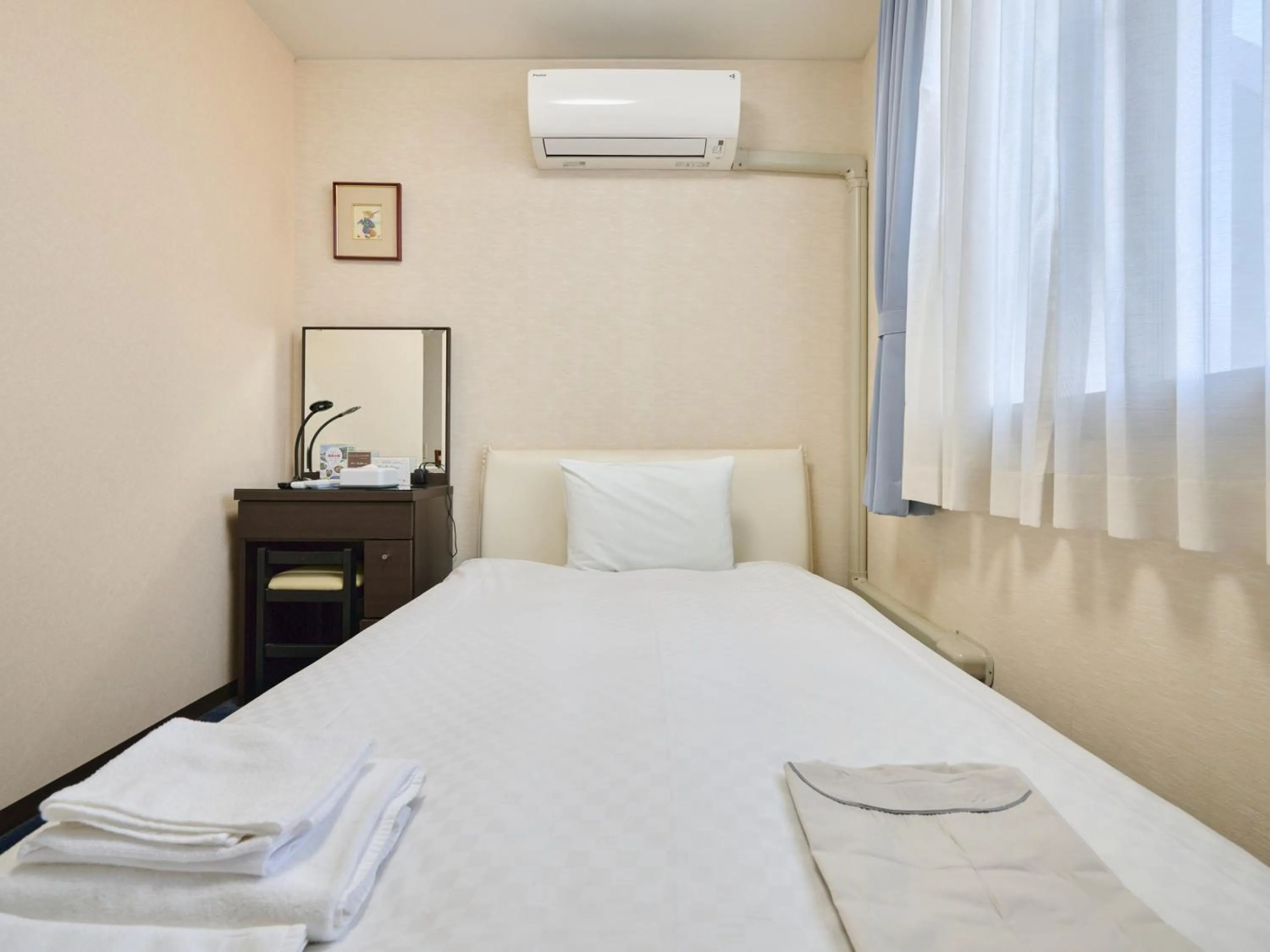 Photo of the whole room, Bed in Okasan Hotel