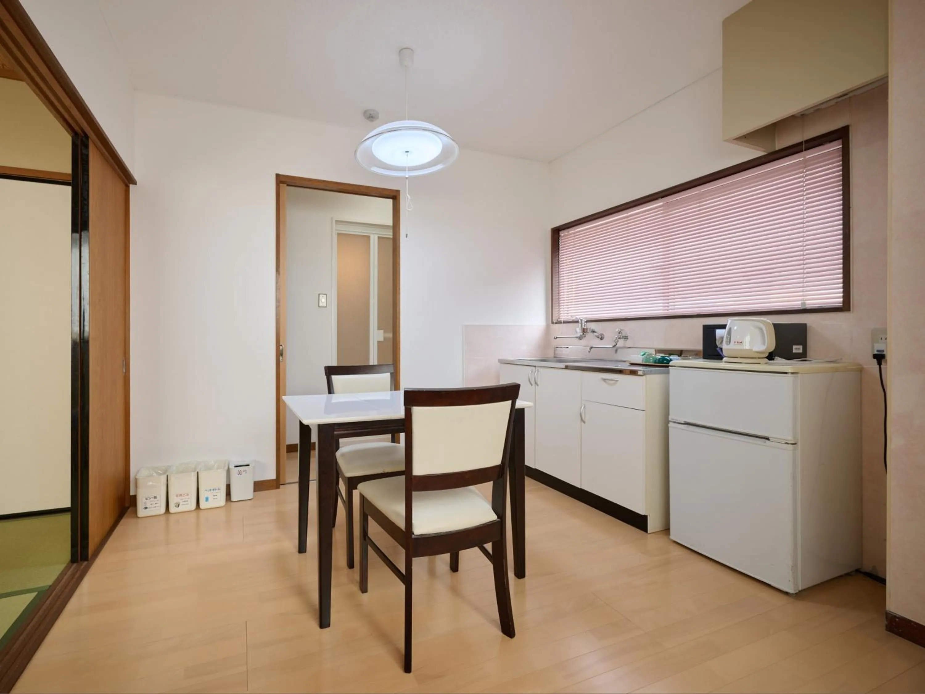 Kitchen or kitchenette in Okasan Hotel