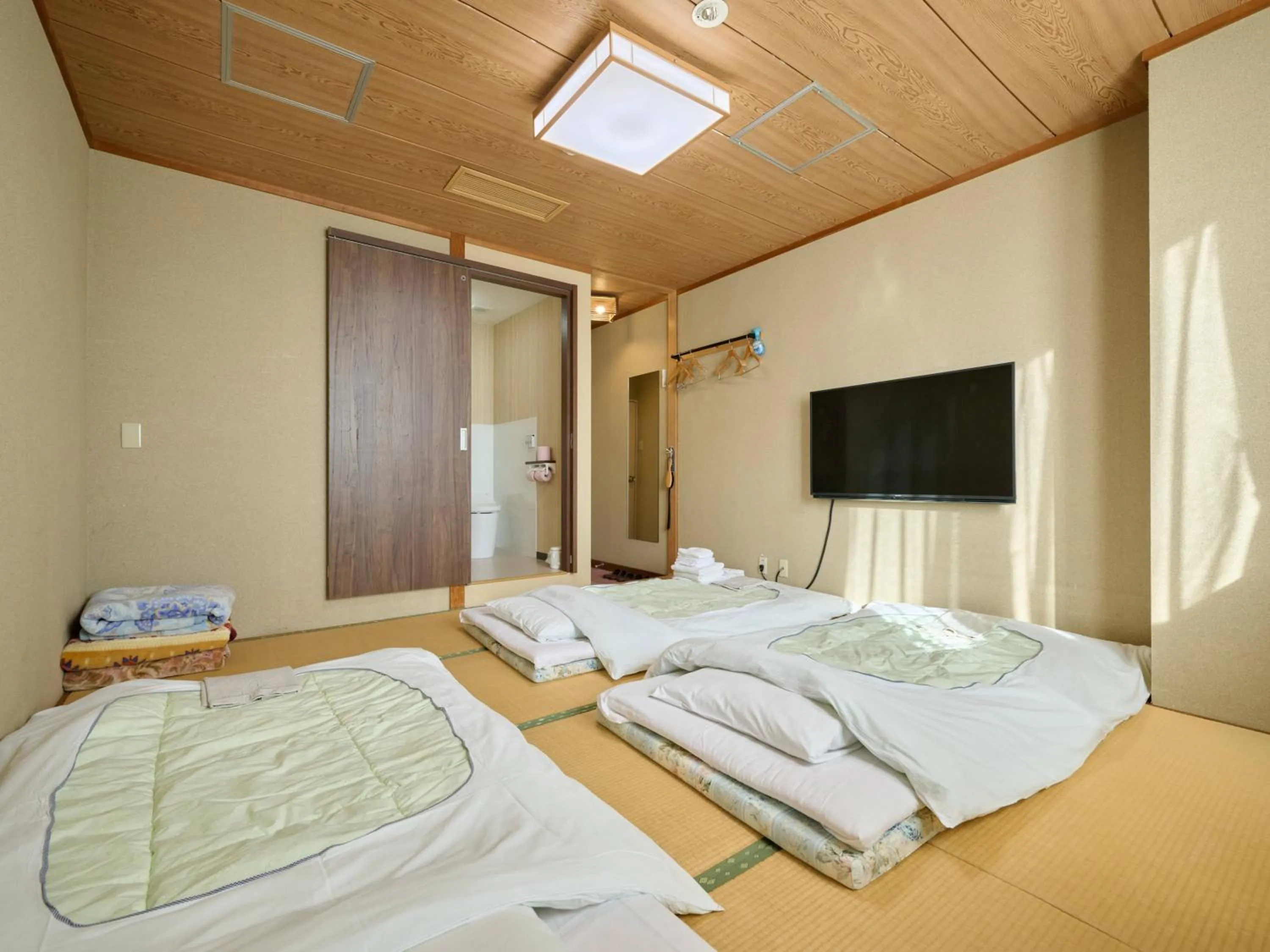 Photo of the whole room, Bed in Okasan Hotel