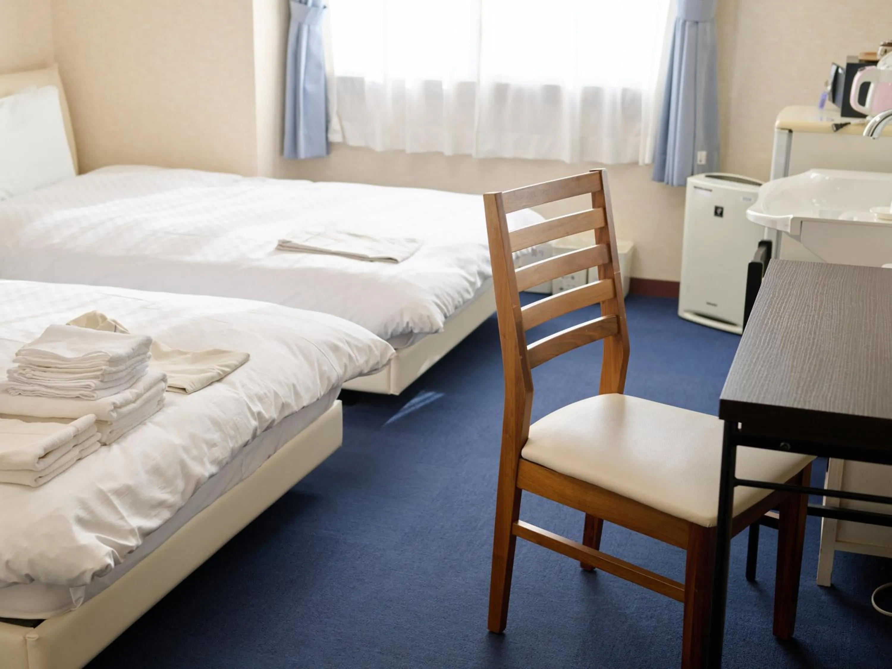Photo of the whole room, Bed in Okasan Hotel