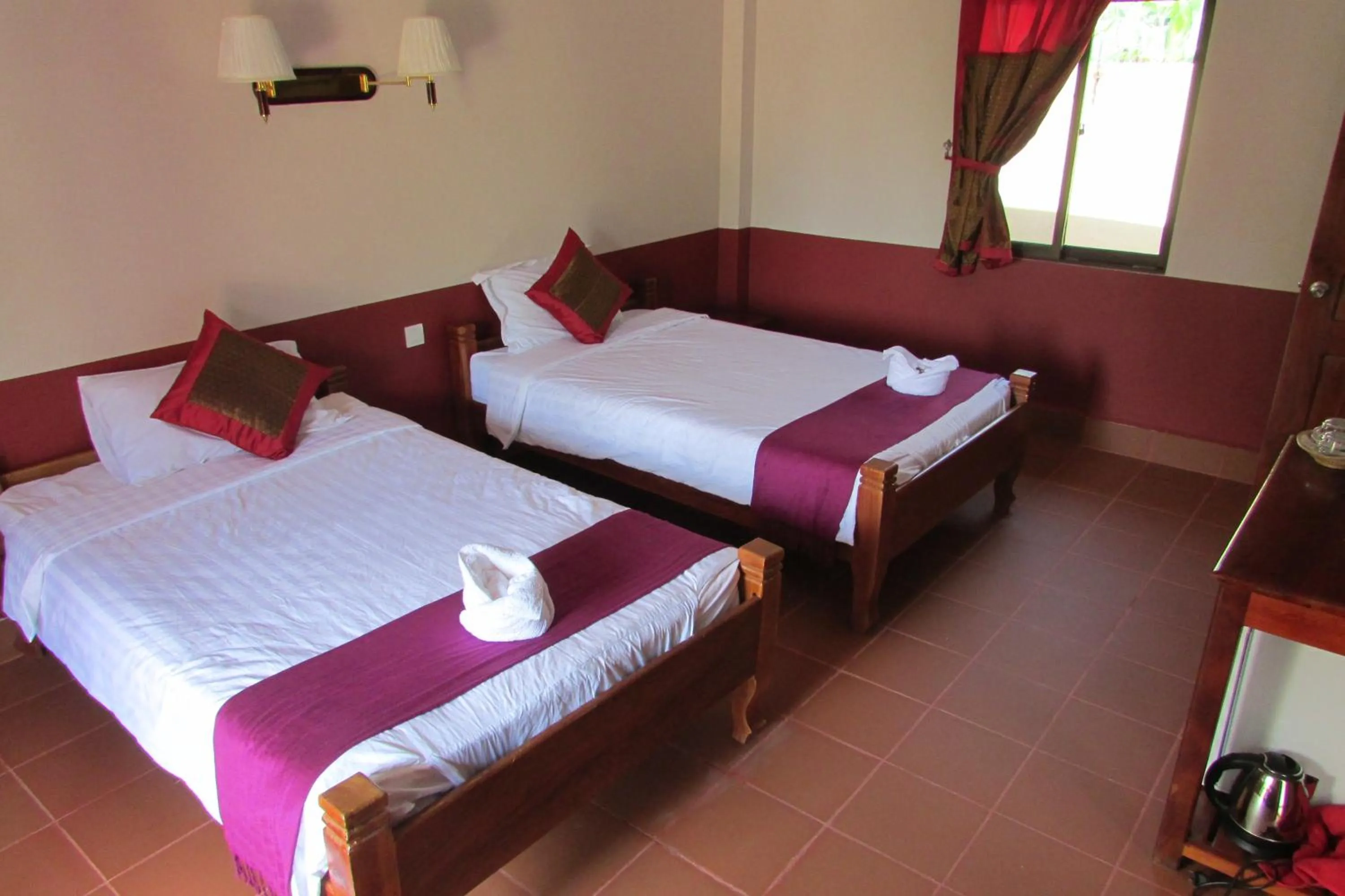 Photo of the whole room, Bed in Phoumrumduol Bungalow