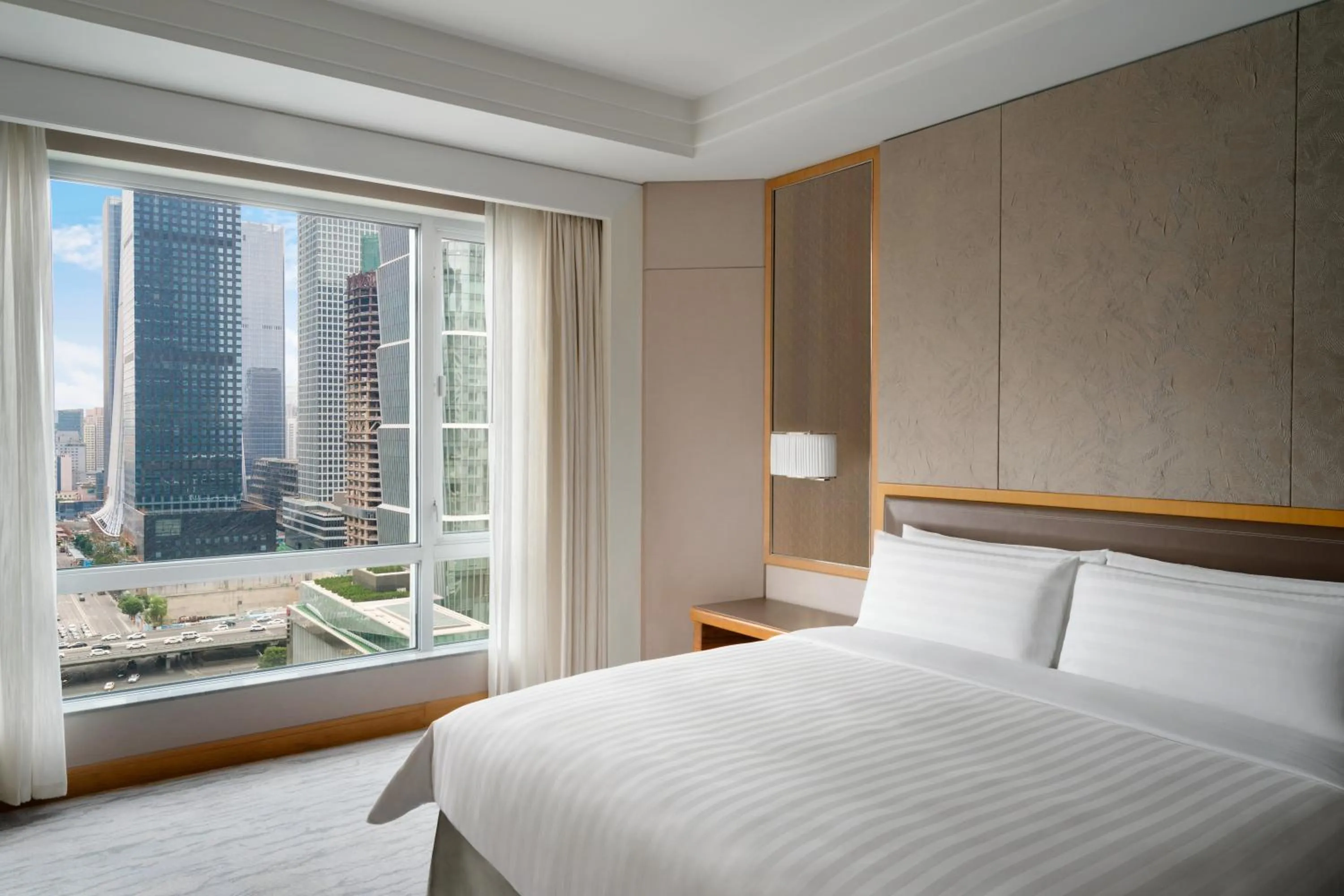 Bed in Kerry Hotel, Beijing by Shangri-La