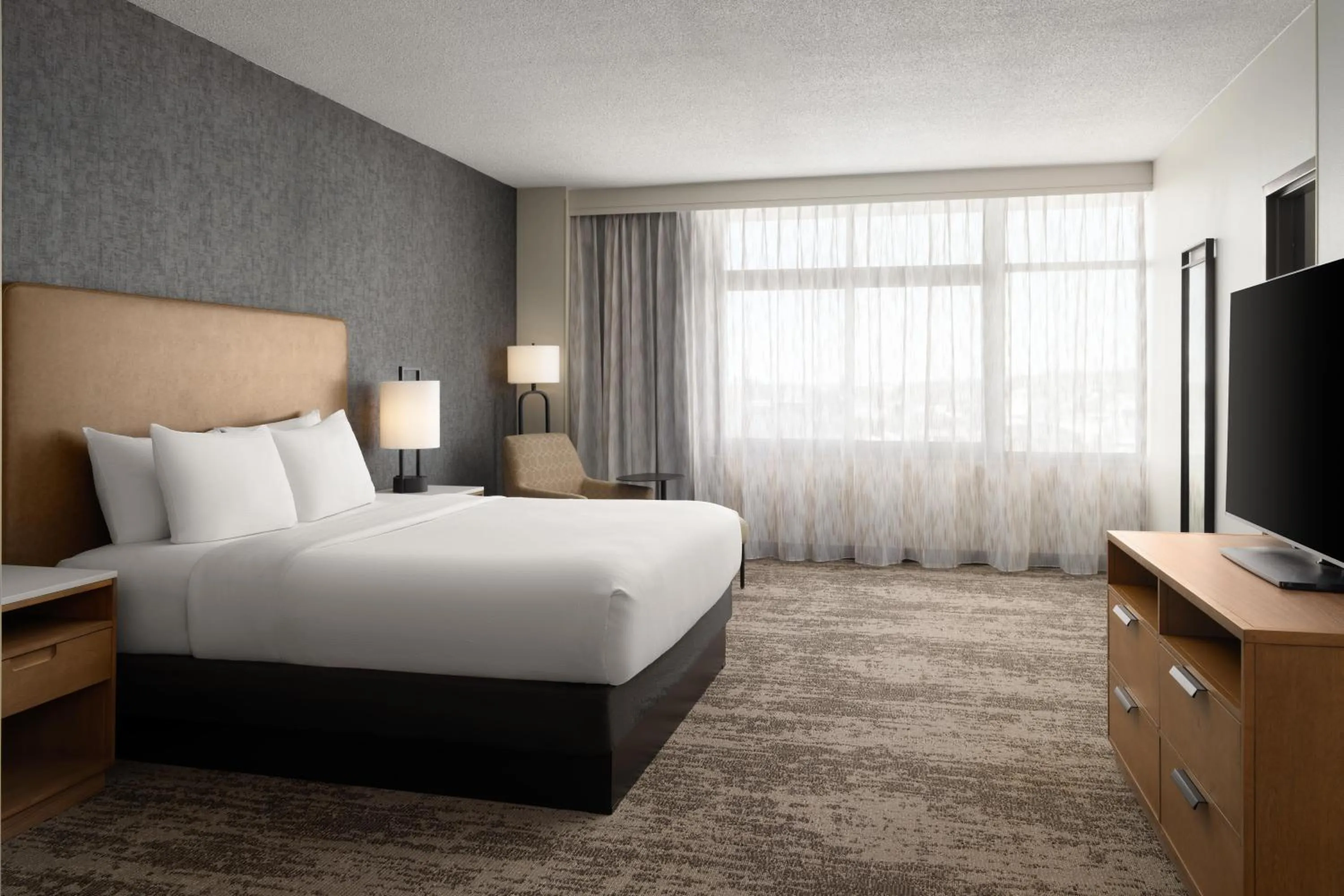 Bed in Embassy Suites by Hilton at Hot Springs Convention Center