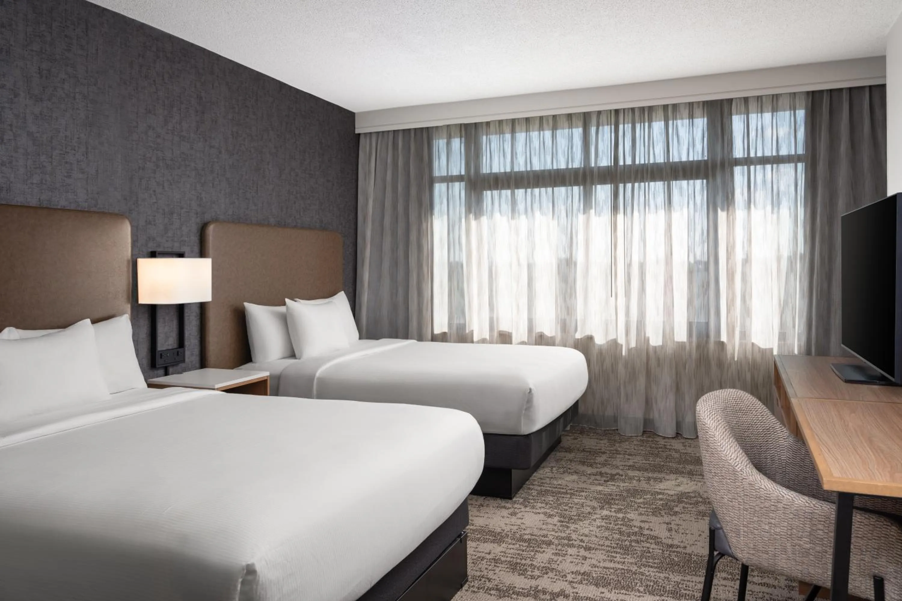 Bed in Embassy Suites by Hilton at Hot Springs Convention Center