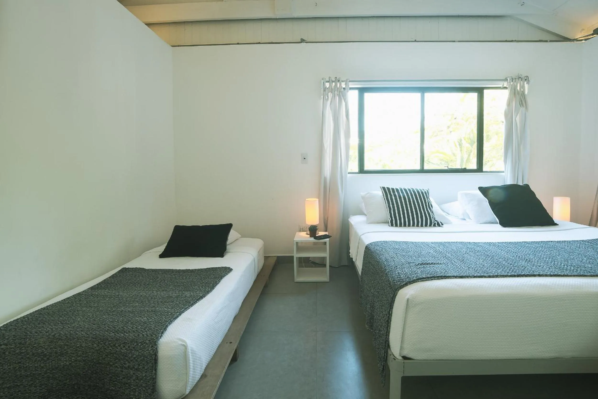 Photo of the whole room, Bed in La Negra Surf Hotel