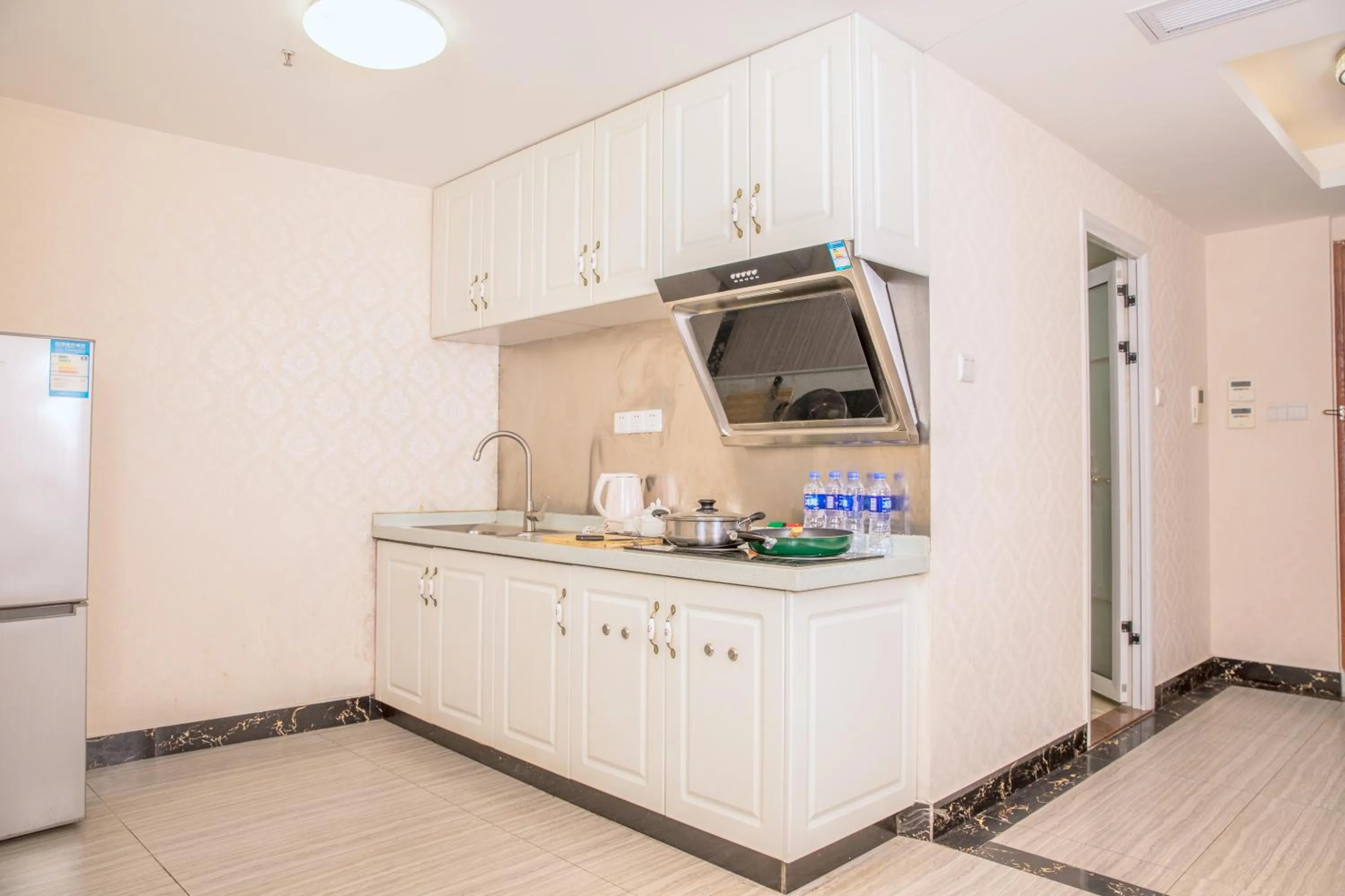 Kitchen or kitchenette in Guangzhou Boman Apartment Zhengjia Huanshi Branch