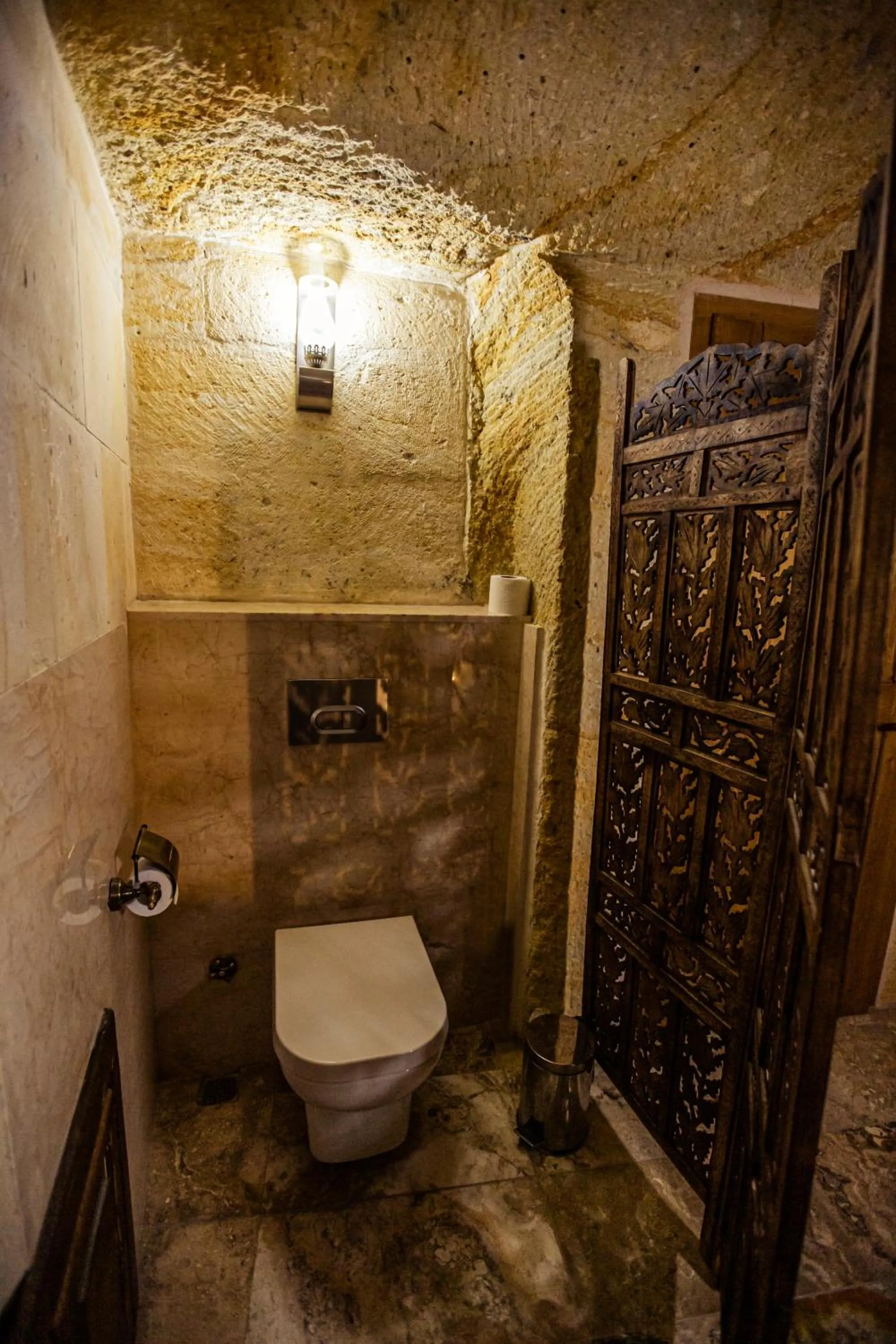 Toilet in Oread Cave Suites