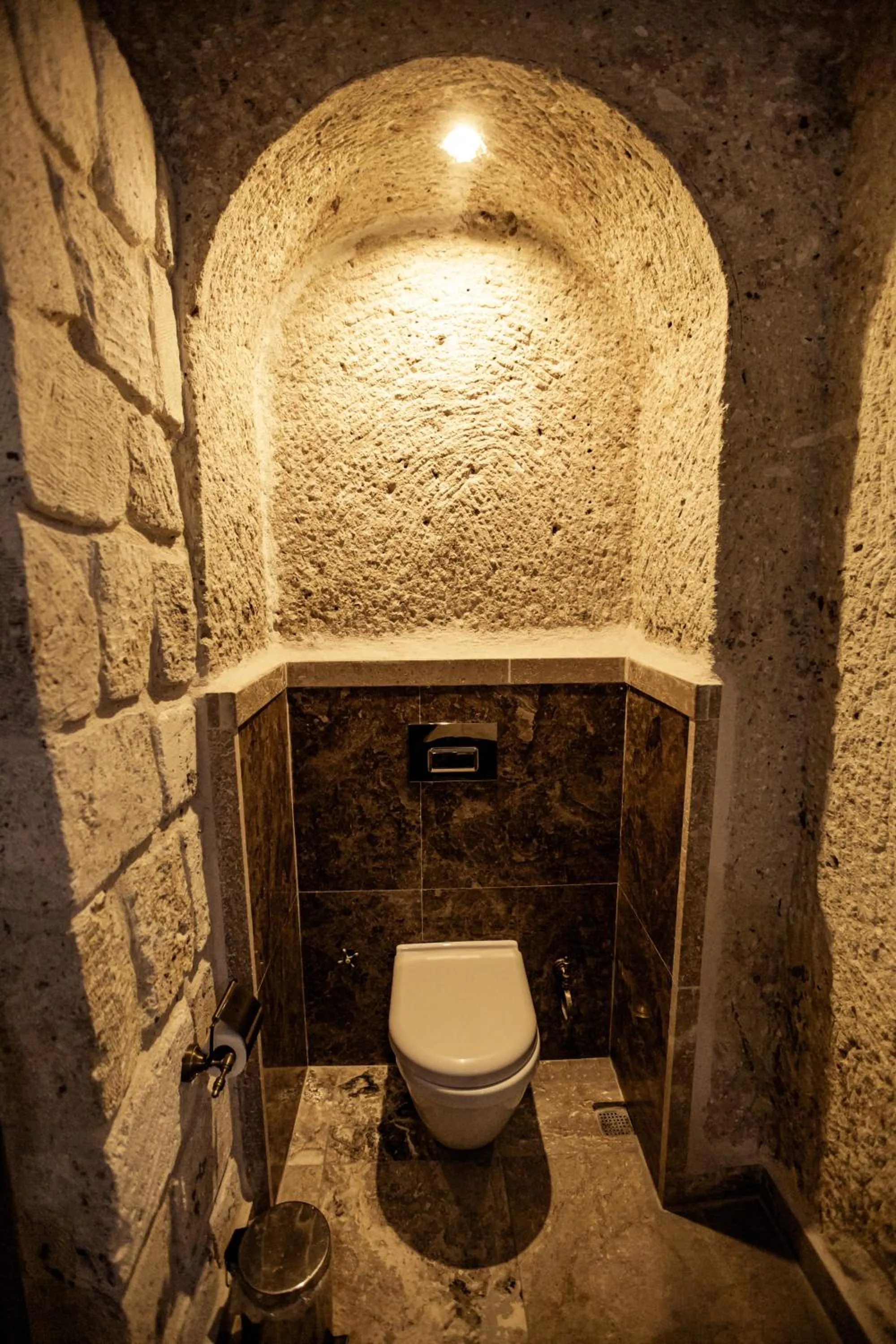 Toilet in Oread Cave Suites