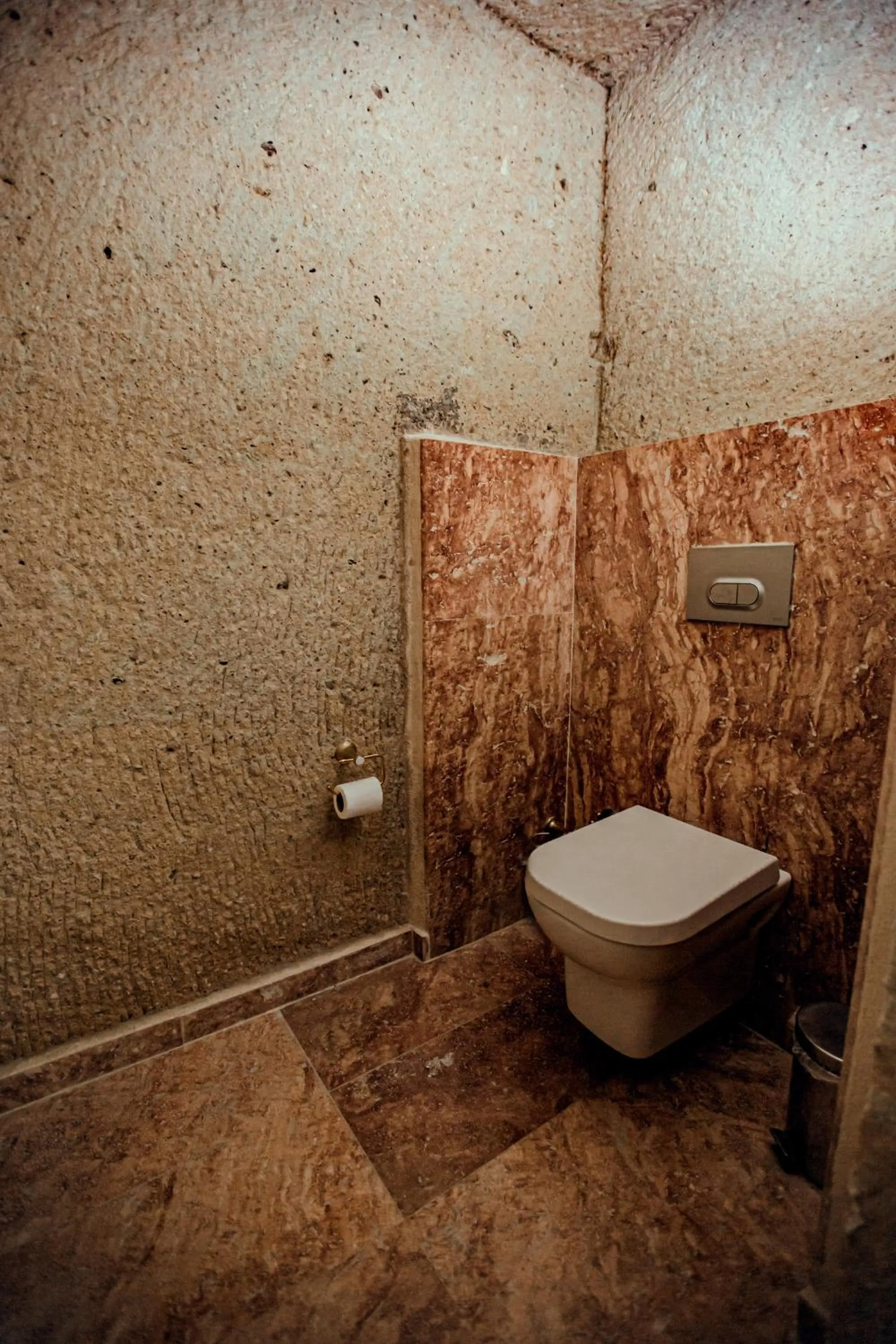 Toilet in Oread Cave Suites