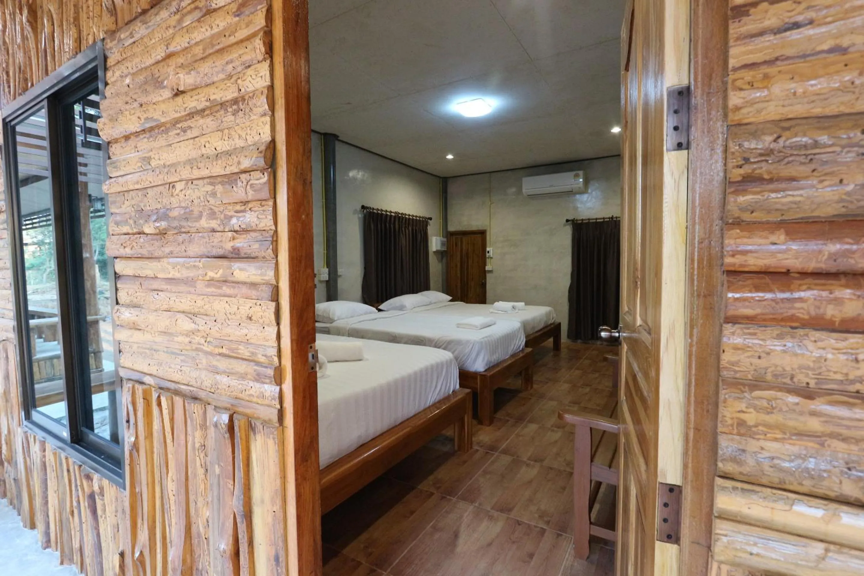 Bed in Baan Khue Wieng Resort