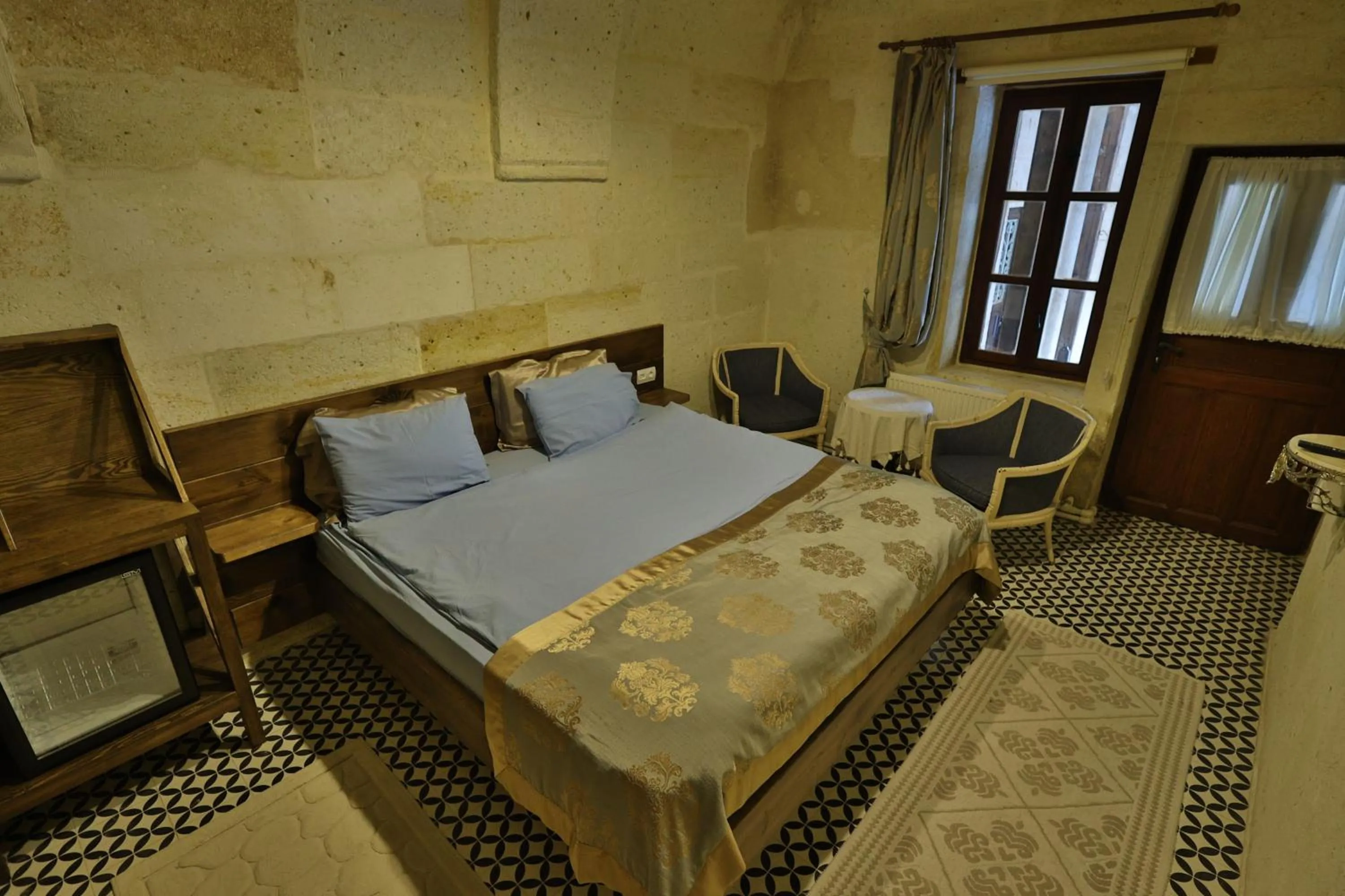 Photo of the whole room, Bed in Demisos Caves Hotel