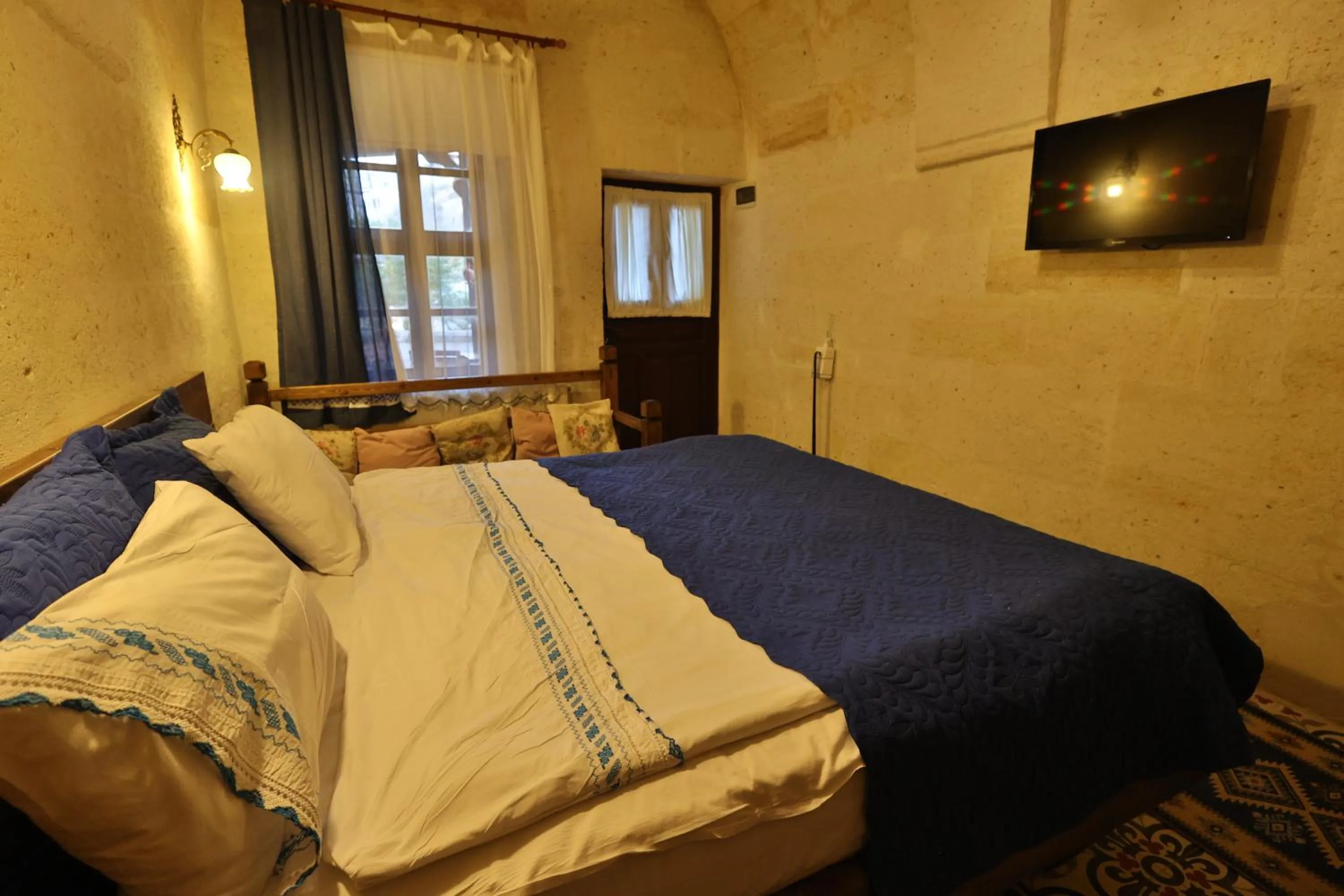 Photo of the whole room, Bed in Demisos Caves Hotel