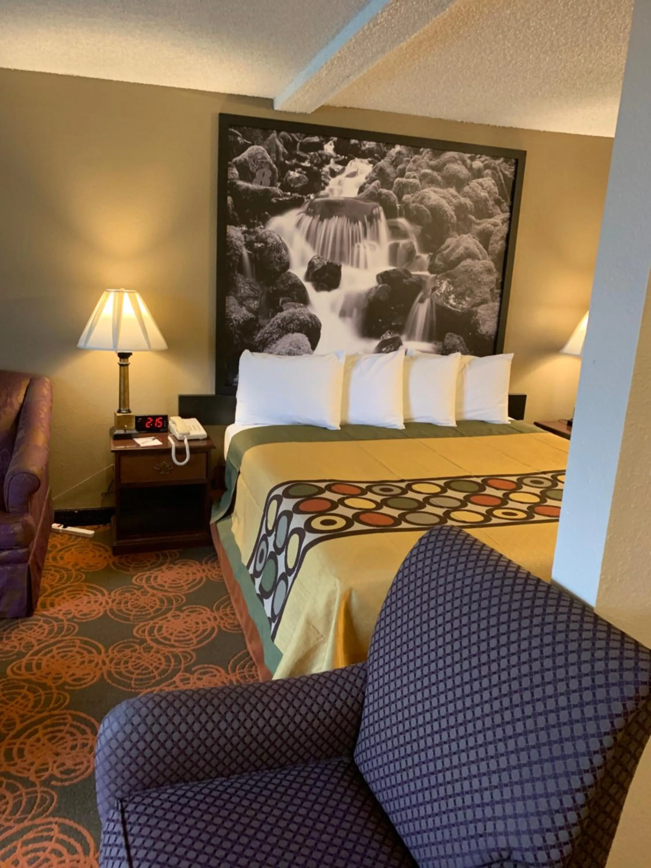 Bed in Sutton Suites Hotel