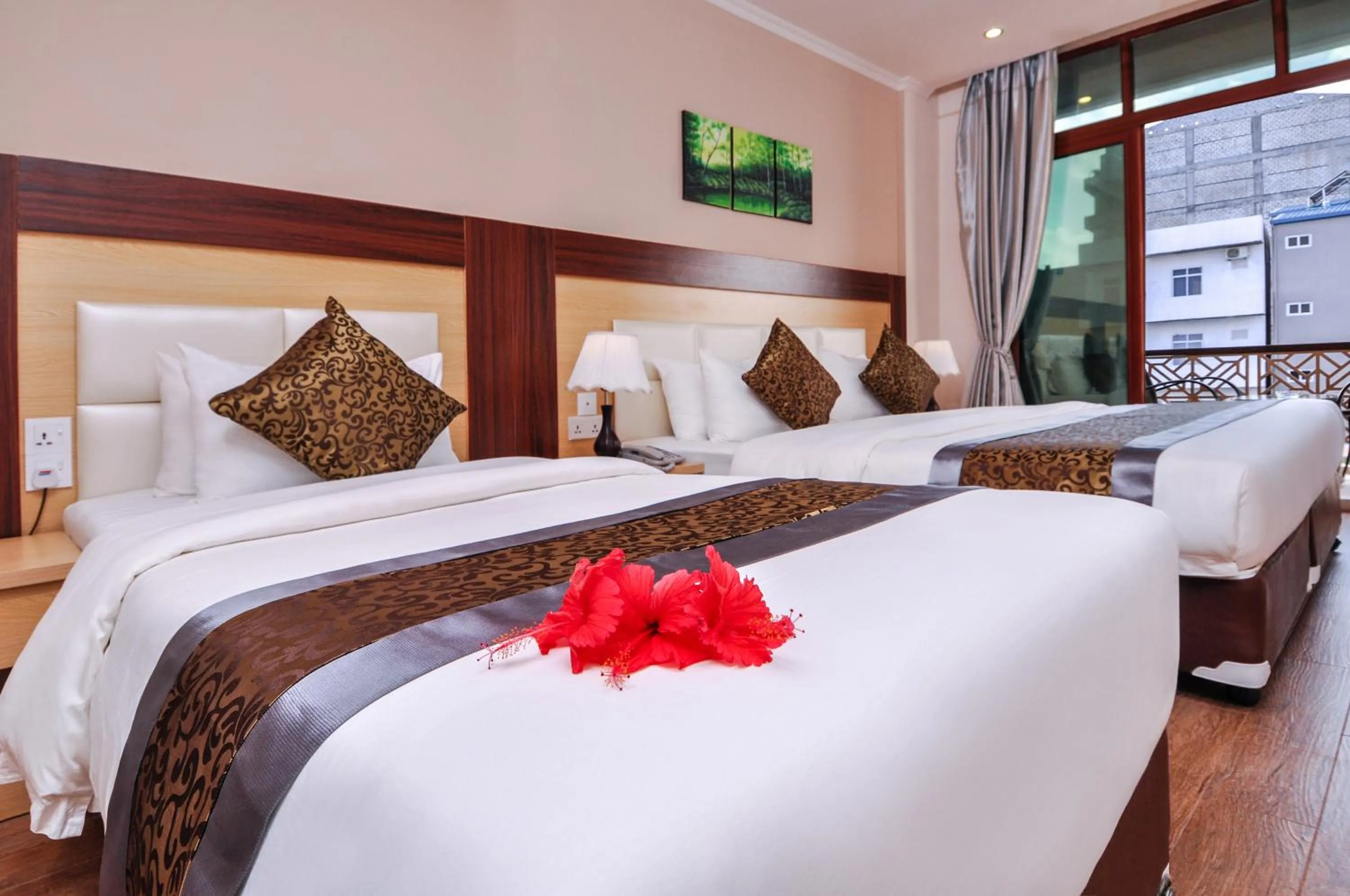 Bed in Triton Beach Hotel & Spa