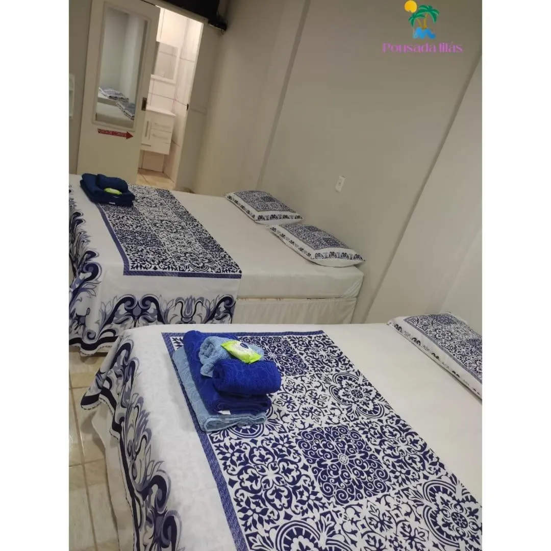 Bed in Pousada Lilás