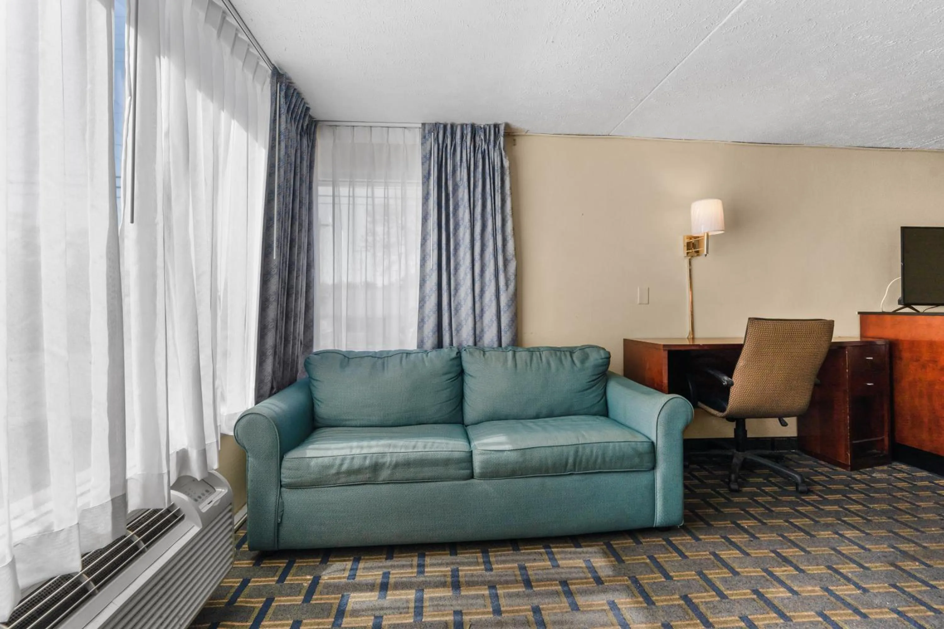 Living room, Seating Area in Days Inn by Wyndham Myrtle Beach-Grand Strand