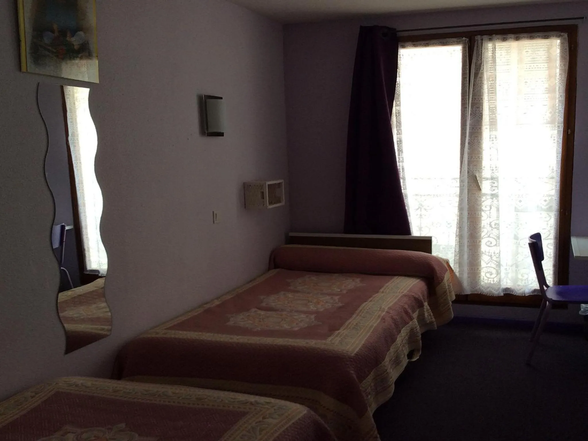 Bed in Hôtel La Fontaine