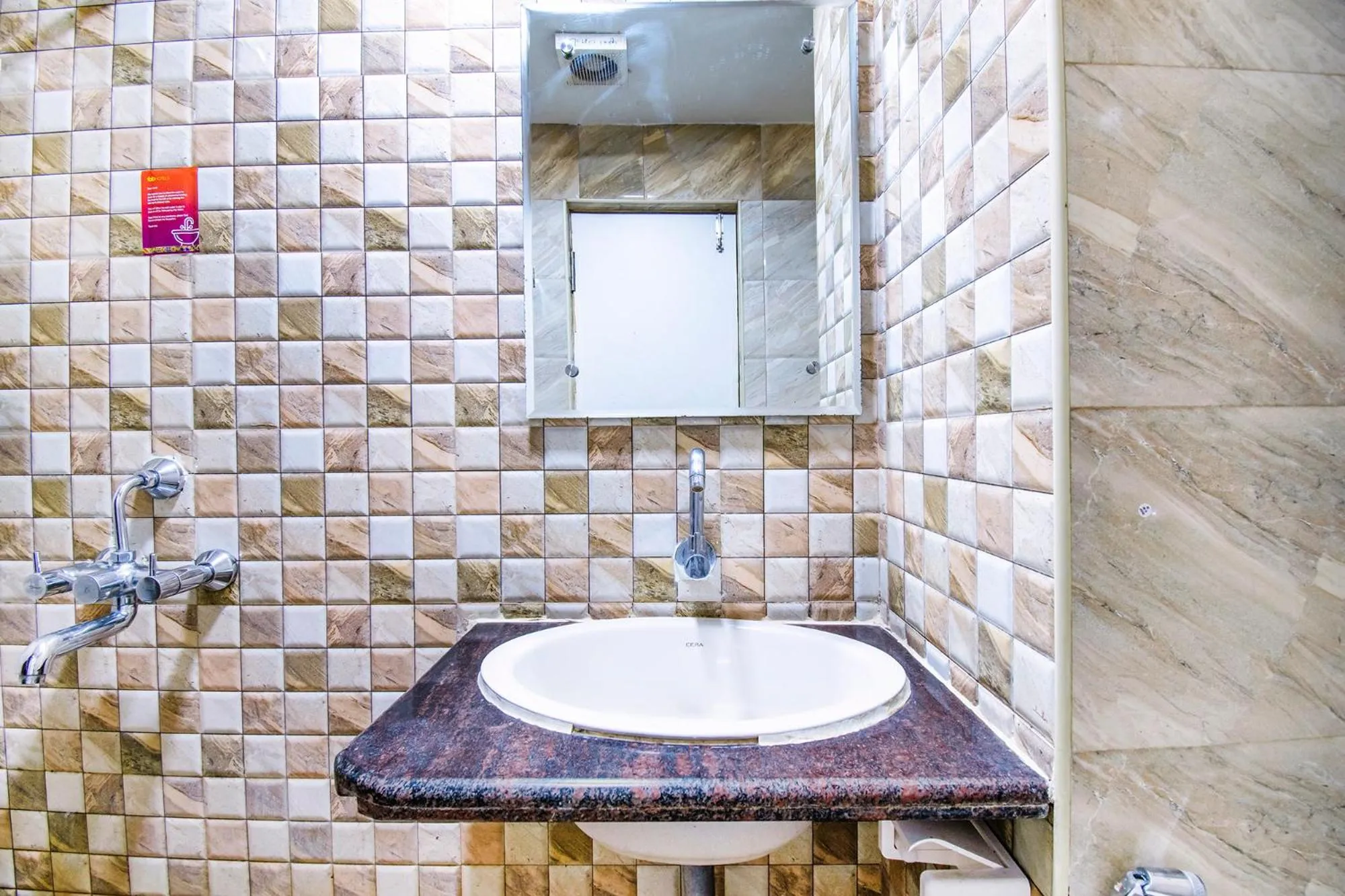 Bathroom in FabHotel Jansi Deluxe - Nr Gandhipuram Bus stand