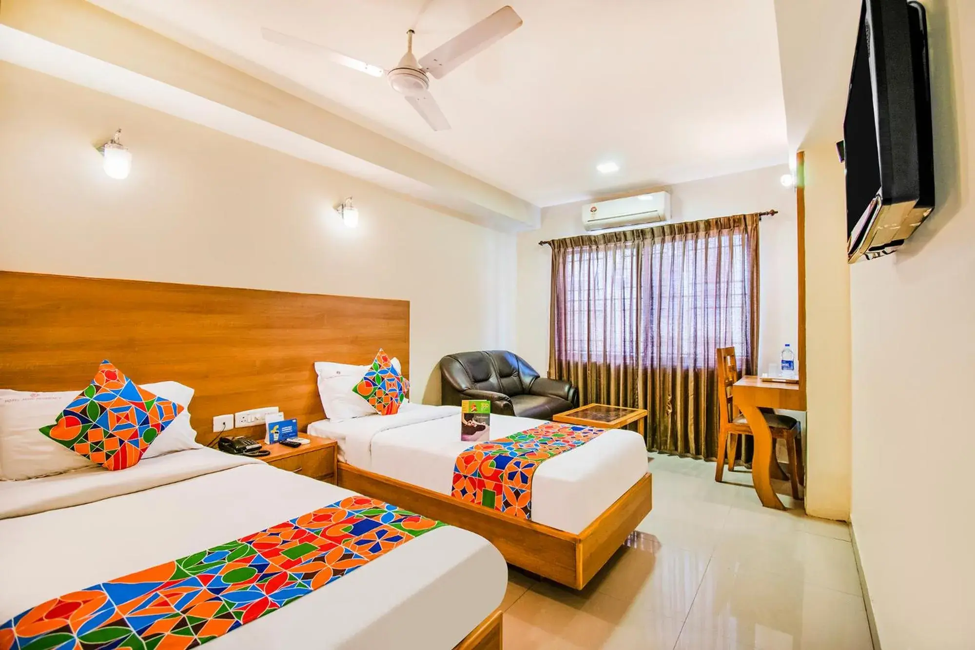 Executive Triple Room - single occupancy in FabHotel Jansi Deluxe - Nr Gandhipuram Bus stand Executive Triple Room - single occupancy in FabHotel Jansi Deluxe - Nr Gandhipuram Bus stand