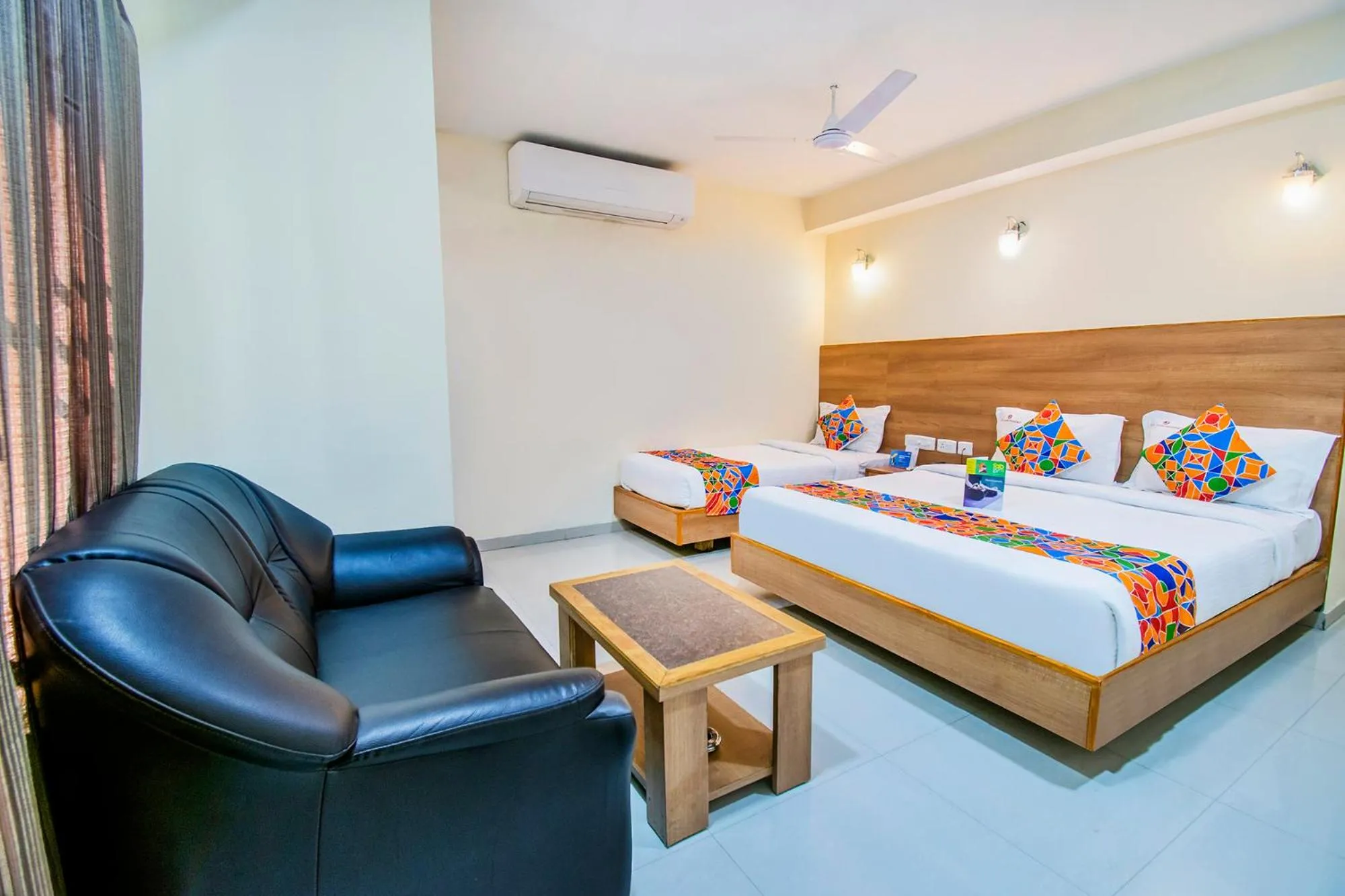 Bed in FabHotel Jansi Deluxe - Nr Gandhipuram Bus stand