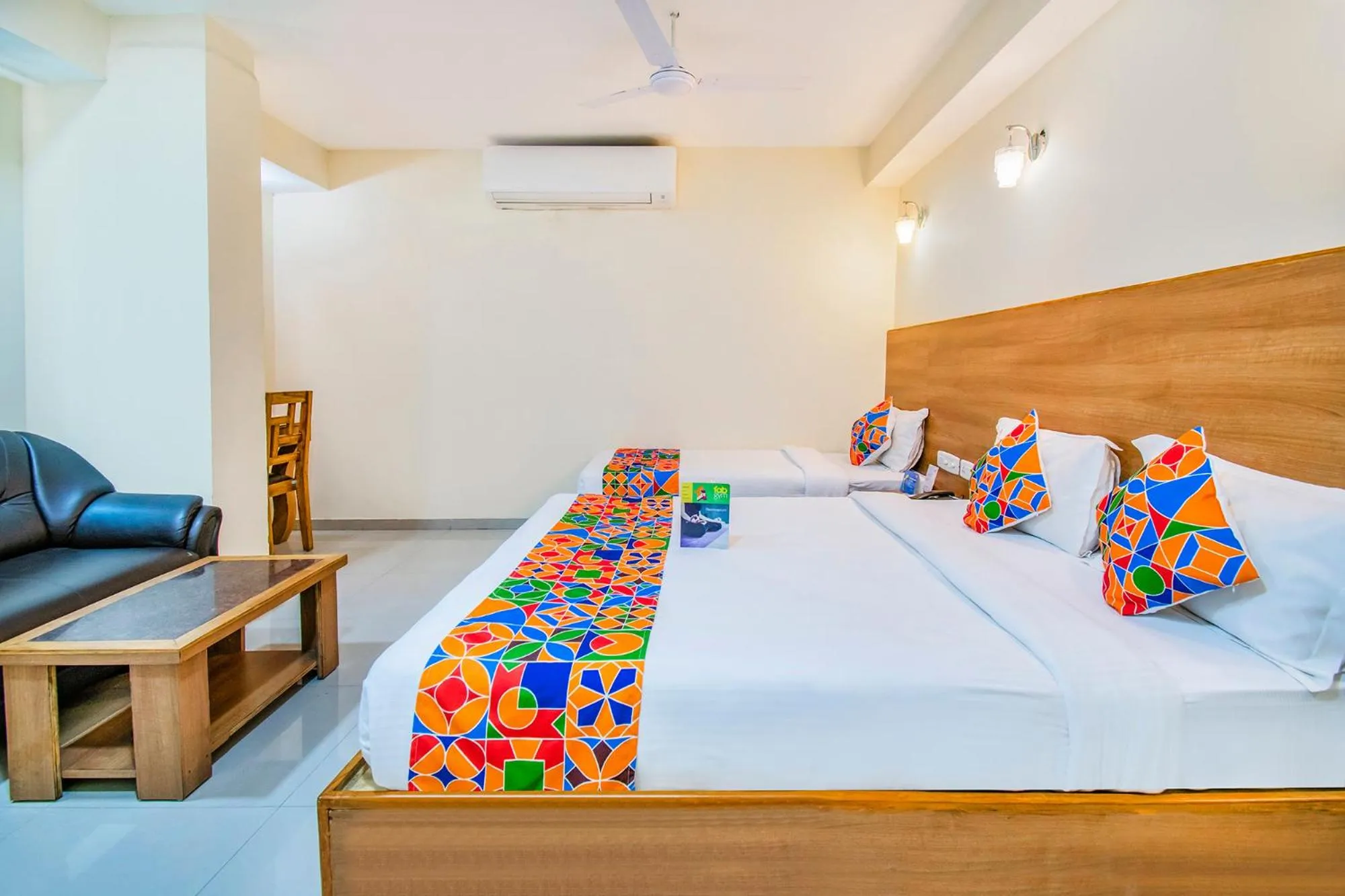 Bed in FabHotel Jansi Deluxe - Nr Gandhipuram Bus stand