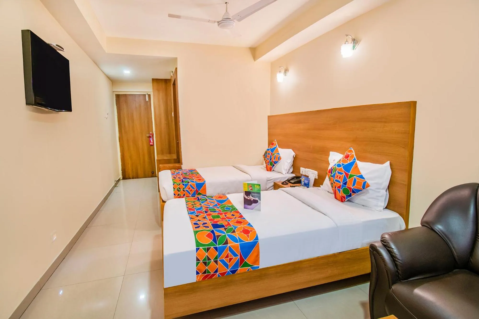 Bed in FabHotel Jansi Deluxe - Nr Gandhipuram Bus stand